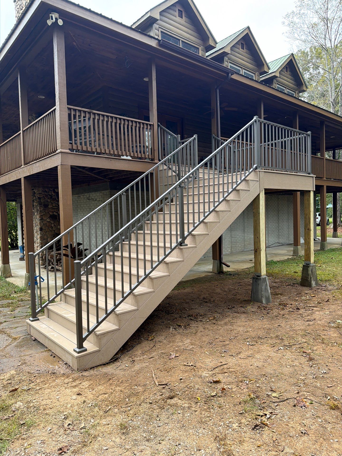Log Cabin Wrap-Around Deck and External Staircase Installation in Caldwell by Walnut Hollow Decks & Outdoor Living