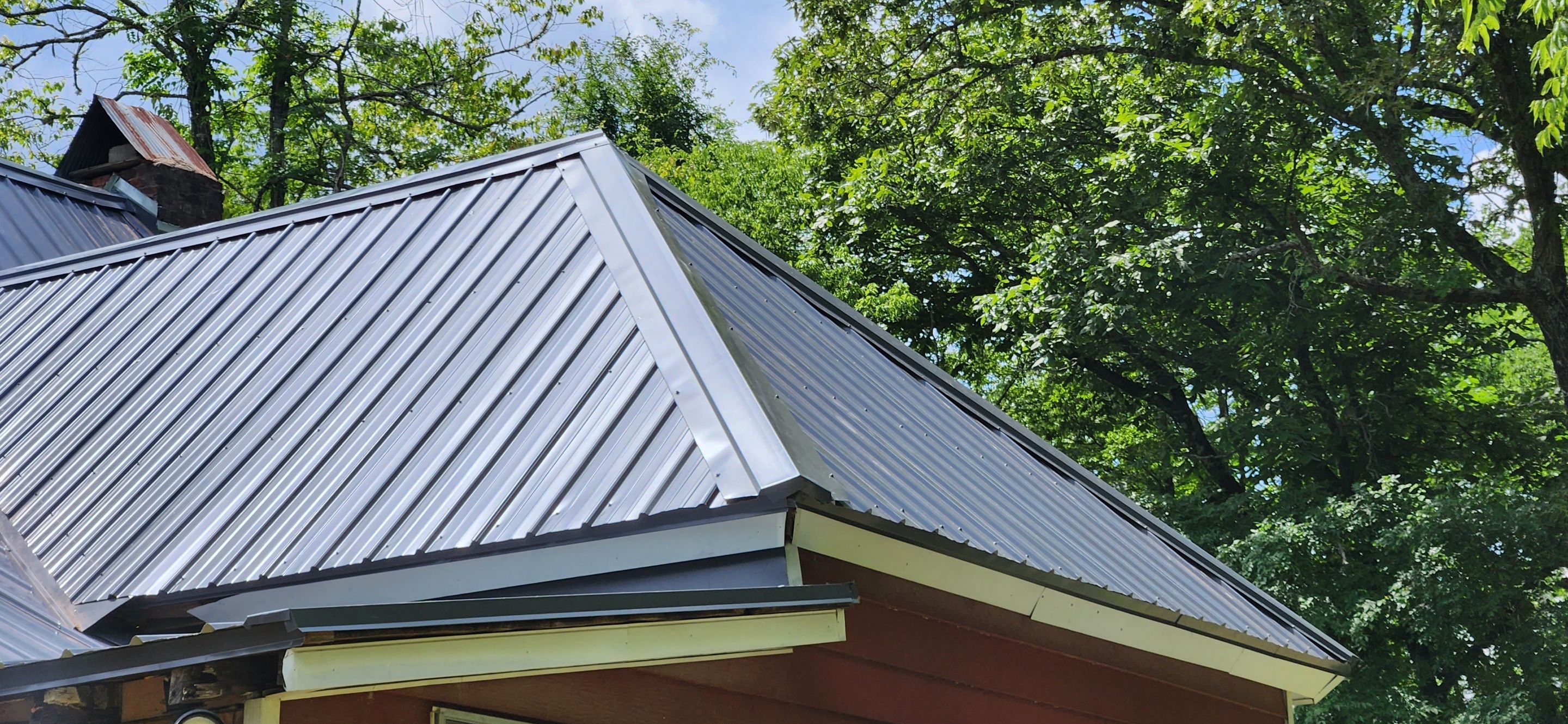 Residential Roofing Installation using 26 Gauge Colored Panels by Hostetler Roofing