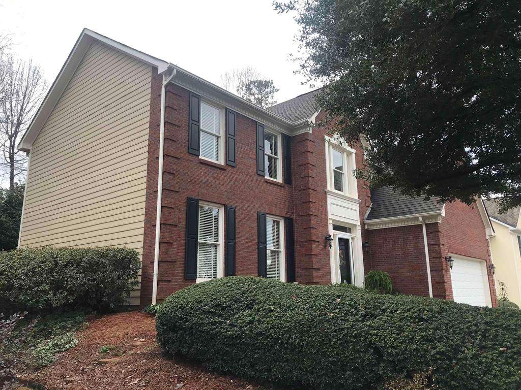Exterior Painting, James Hardie Siding Install, and Gutter Replacement in Alpharetta, GA - After Results Taken Six Years After Painted by Nelson Exteriors 