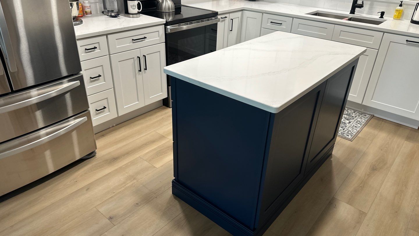 Live Oak Kitchen Refresh Featuring White Shaker Cabinets and Navy Island by Legacy Bath and Kitchen 