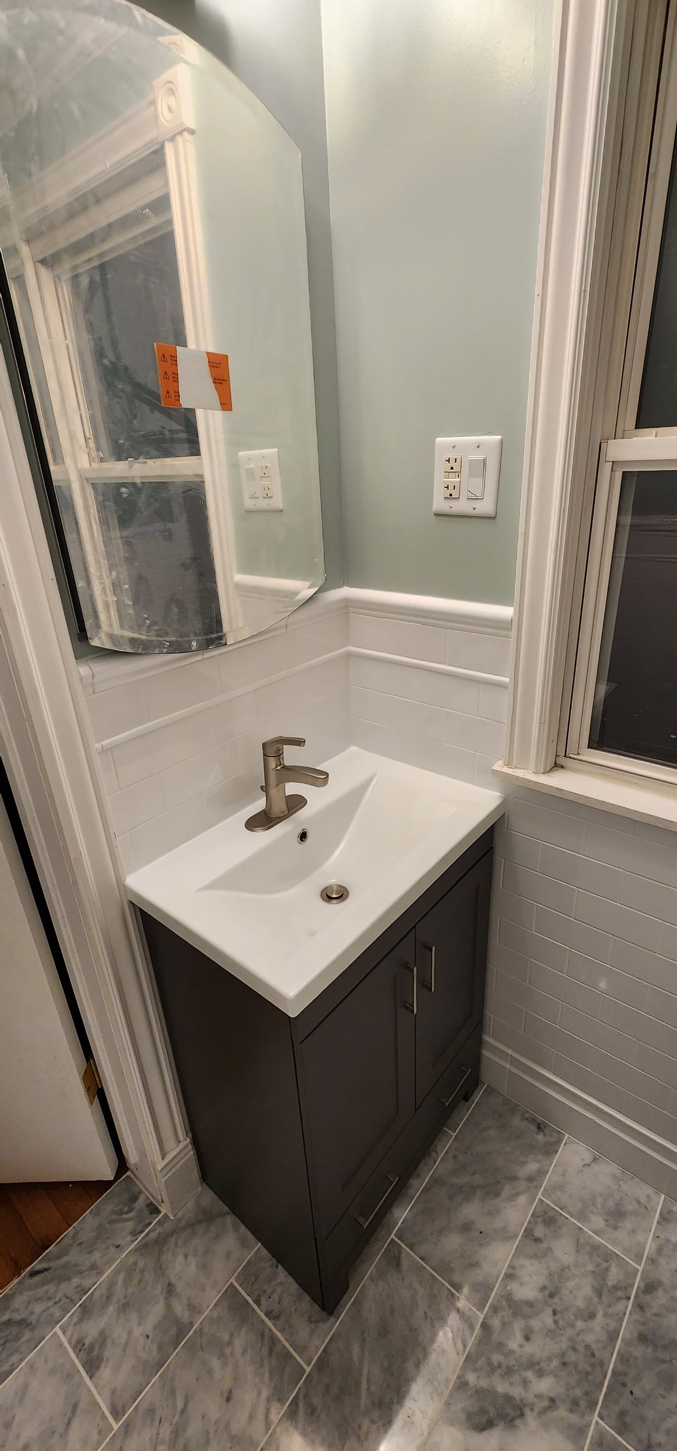Full bathroom, tile shower, tile floor, tile wainscoting by The Shower Company