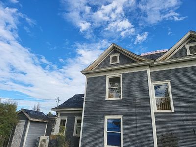 Meridian two story roofing installation using Owens Corning Duration in Onyx Black
