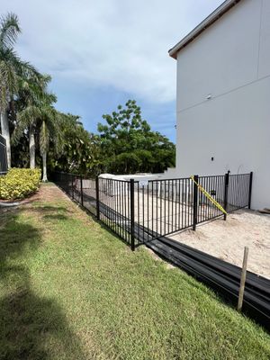 Aluminum Fence Installation using Black 3 Rail Aluminum Fence
