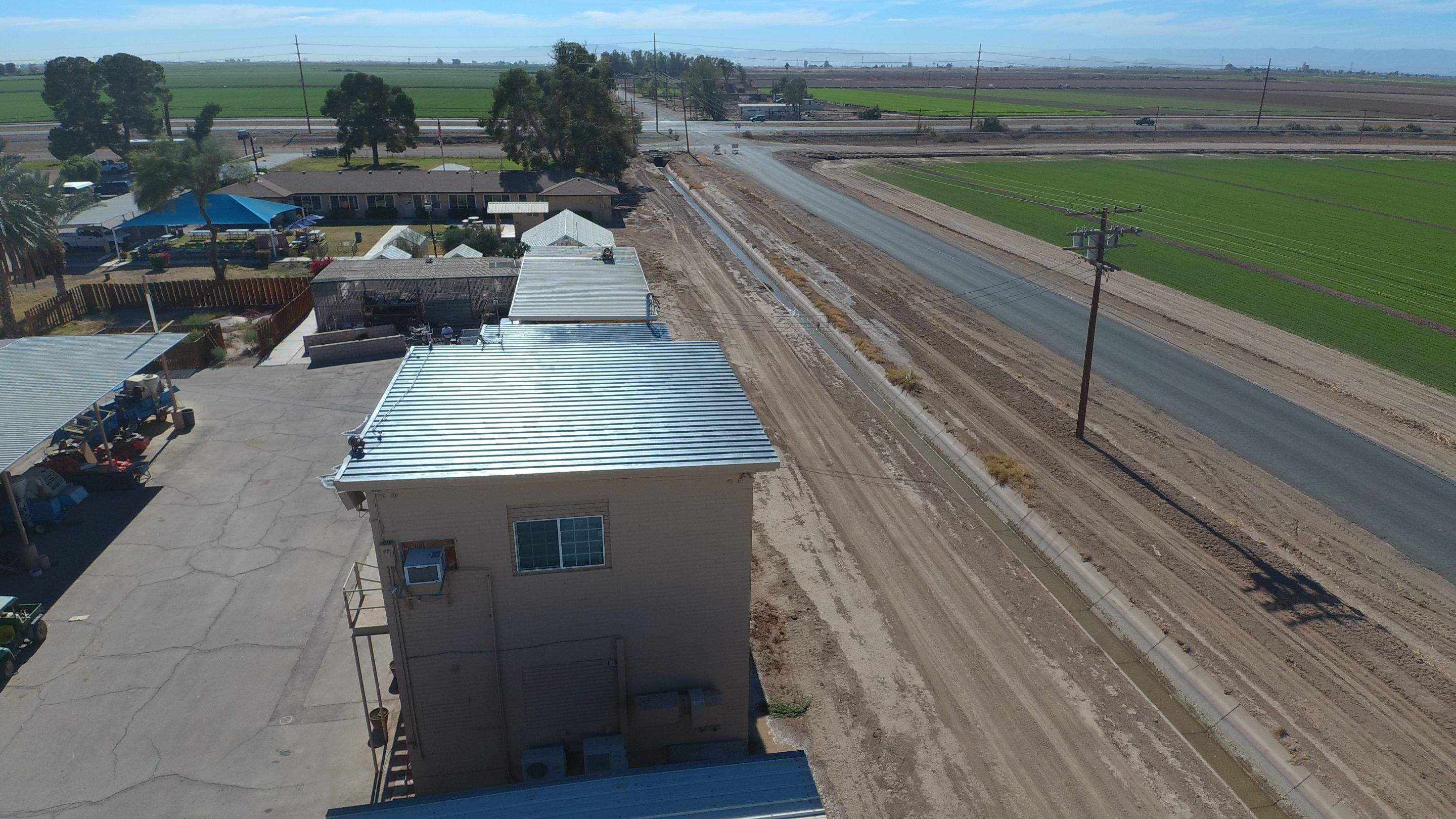 Metal roof restoration on commercial roof using Conklin Benchmark/PUMA XL fabric and coating by Straight Edge Roofing Inc