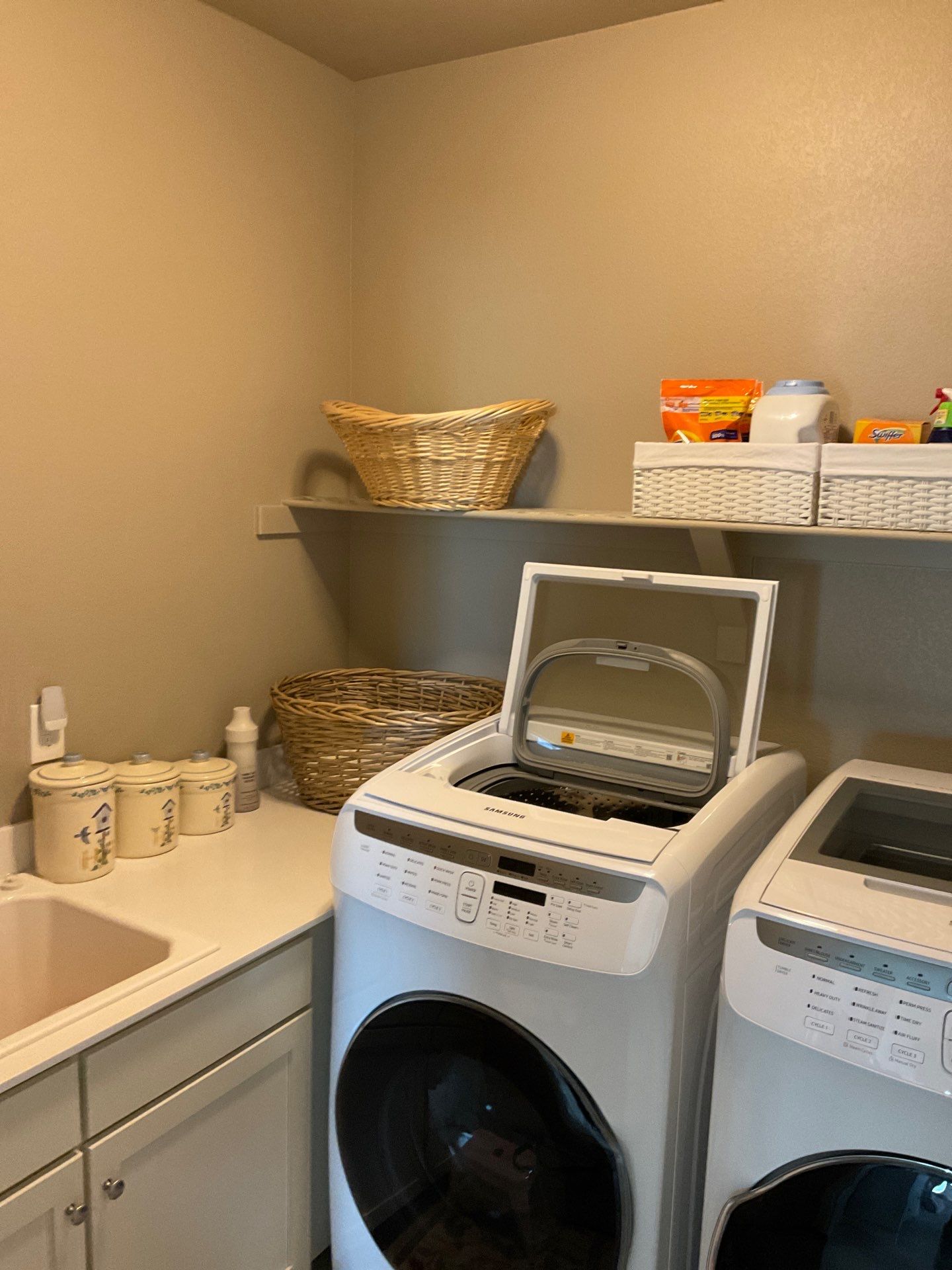 Laundry Room designed to match closets by Concept 32, Inc.
