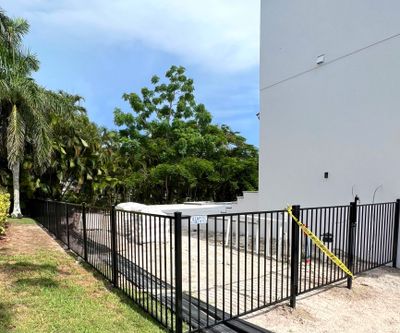Aluminum Fence Installation using Black 3 Rail Aluminum Fence