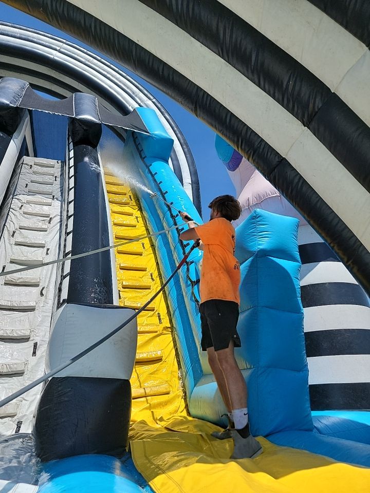 Cleaning for big bounce america prior to a large event by Northern Power Washing LLC.