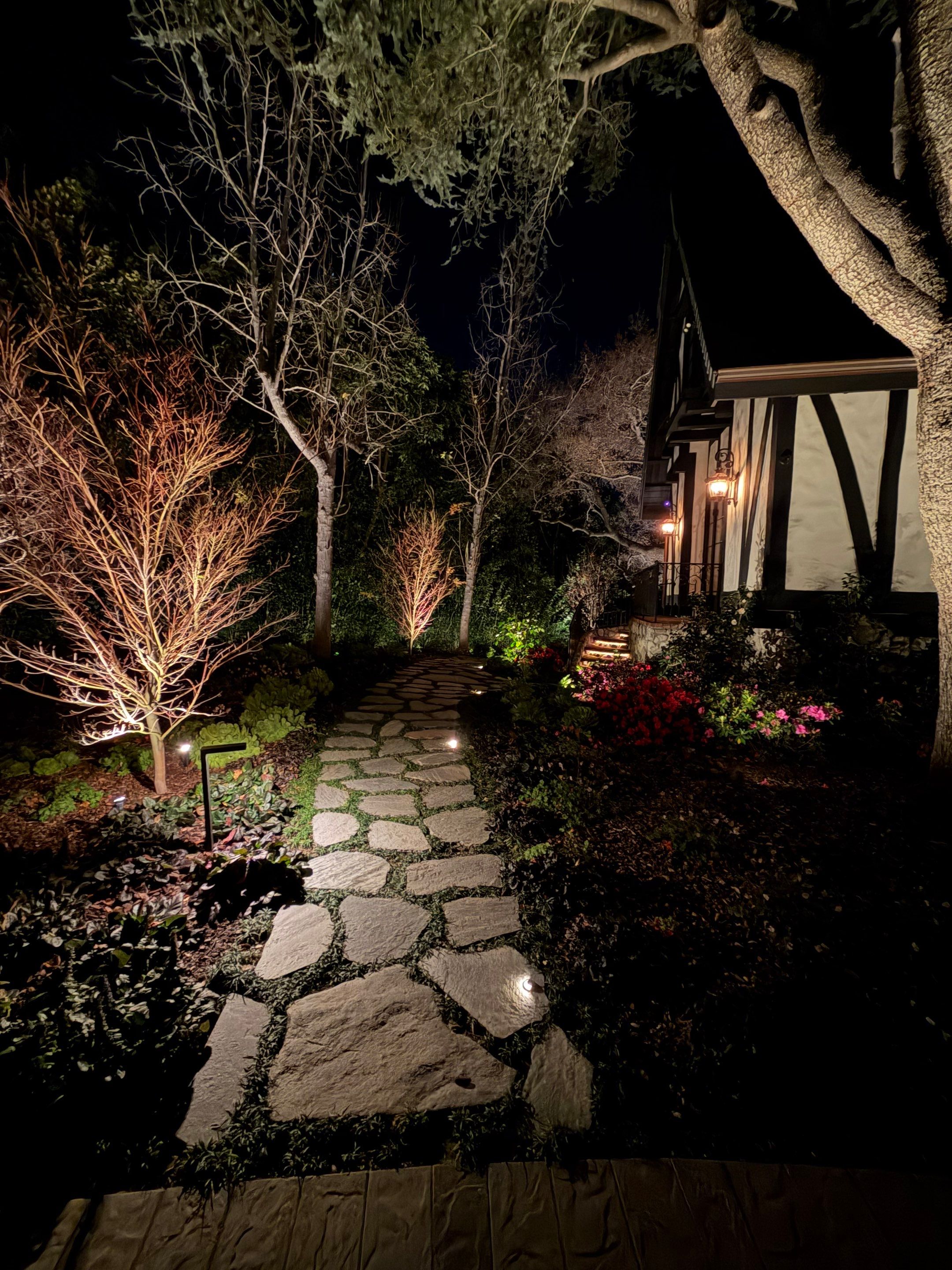 Tudor Estate Landscape Lighting with Integrated Stone Step Illumination by Outdoor Lights + Shades