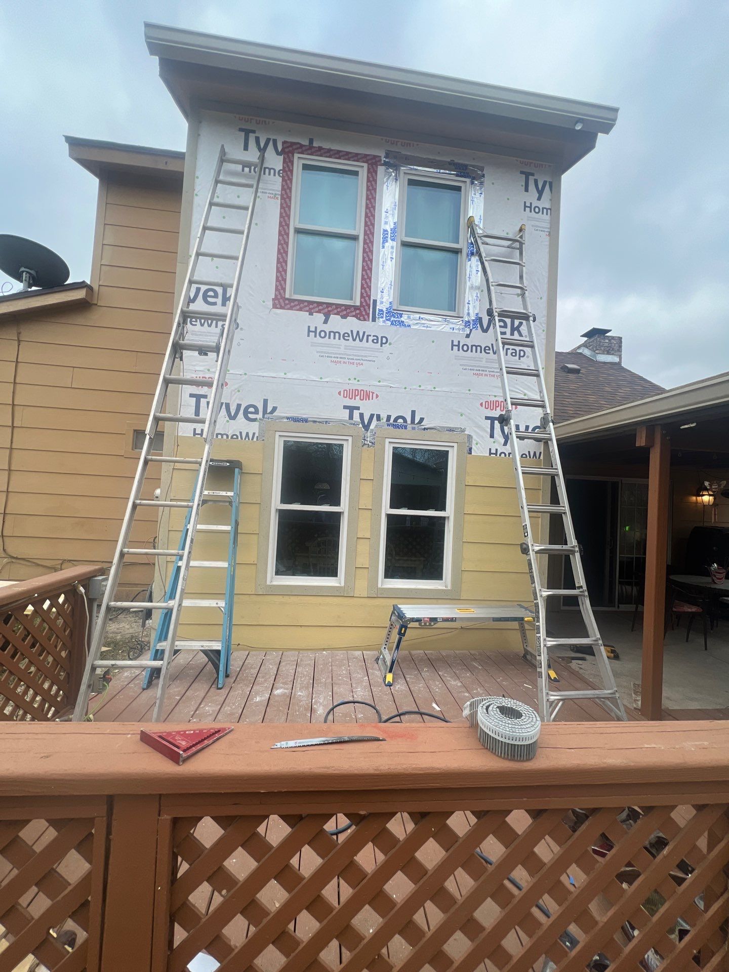 Installing Windows on a Submarine  by Bayfront Roofing and Construction