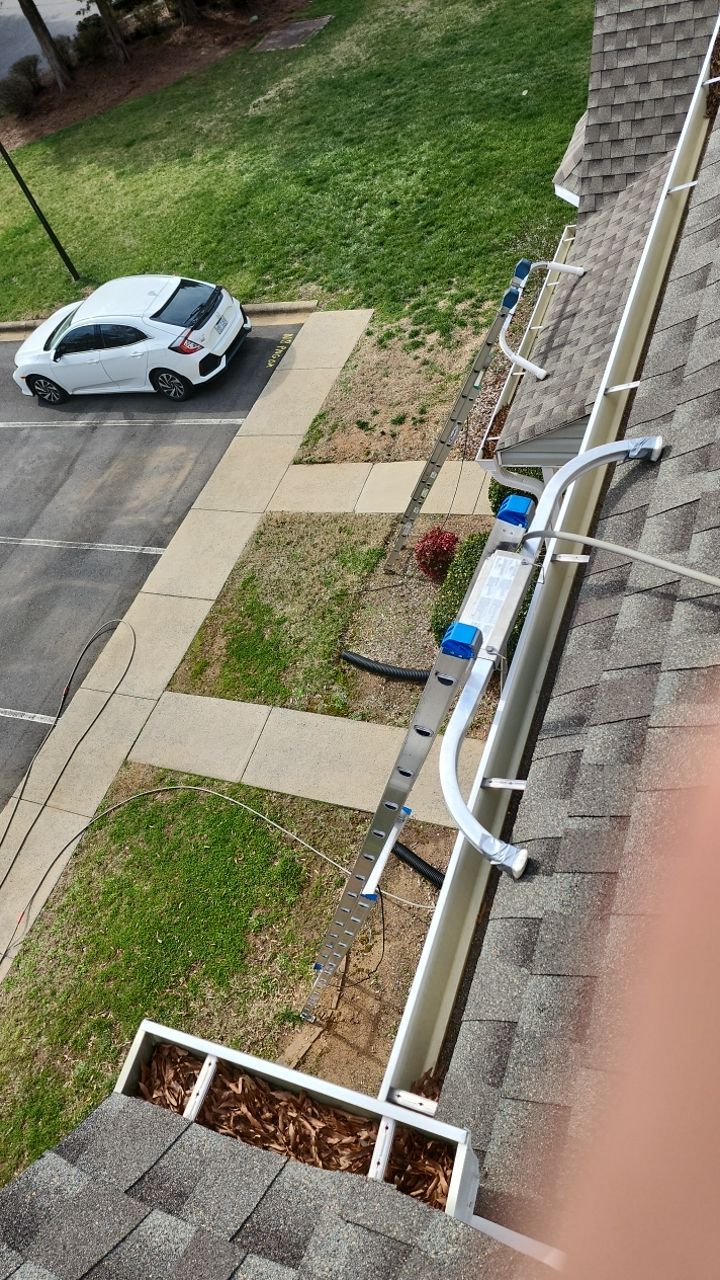 Gutter Cleaning using water by Power Wash Masters LLC