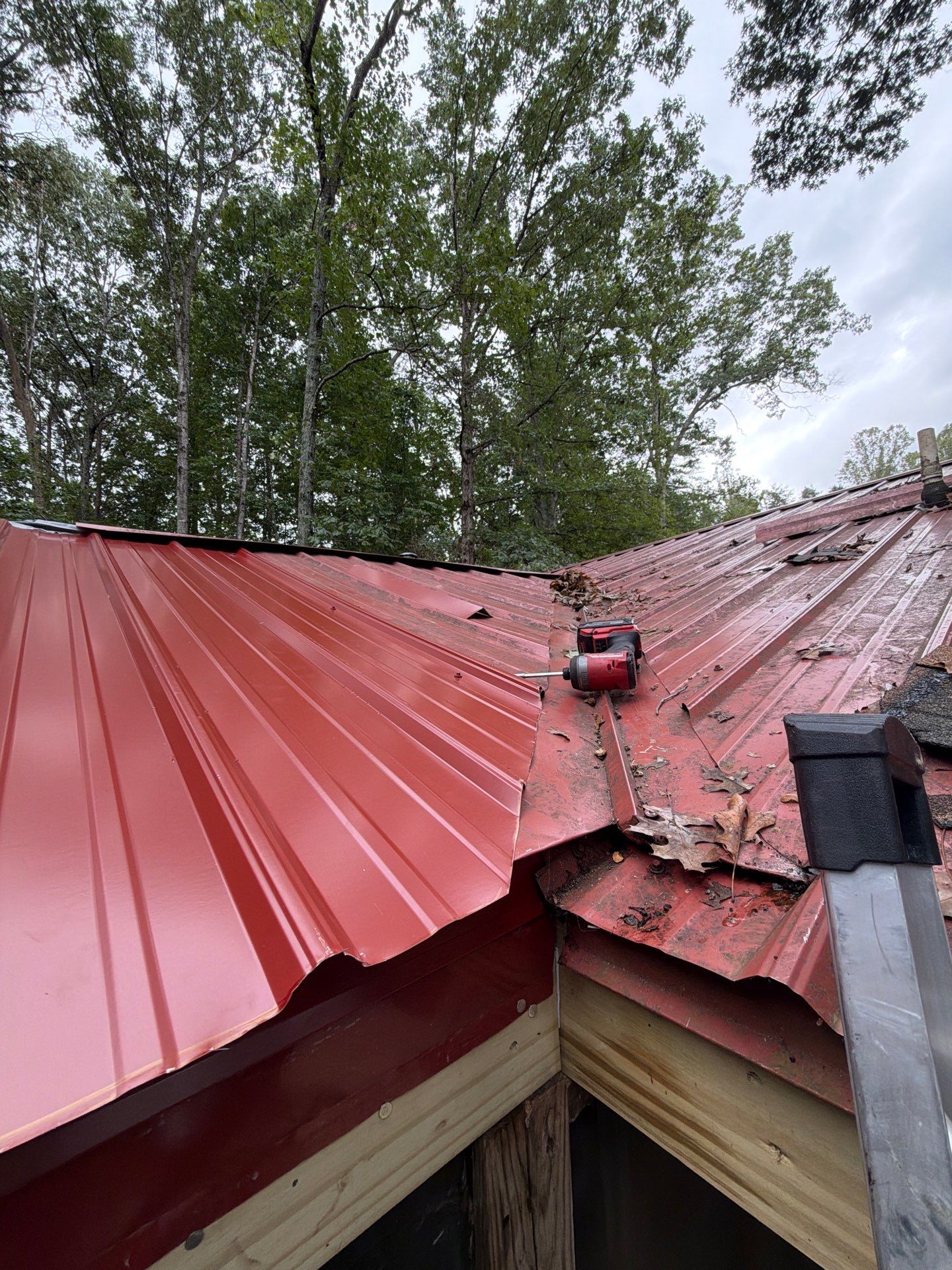 Red Metal Roof Restoration and Wood Fascia Replacement in Barboursville by Cade Construction