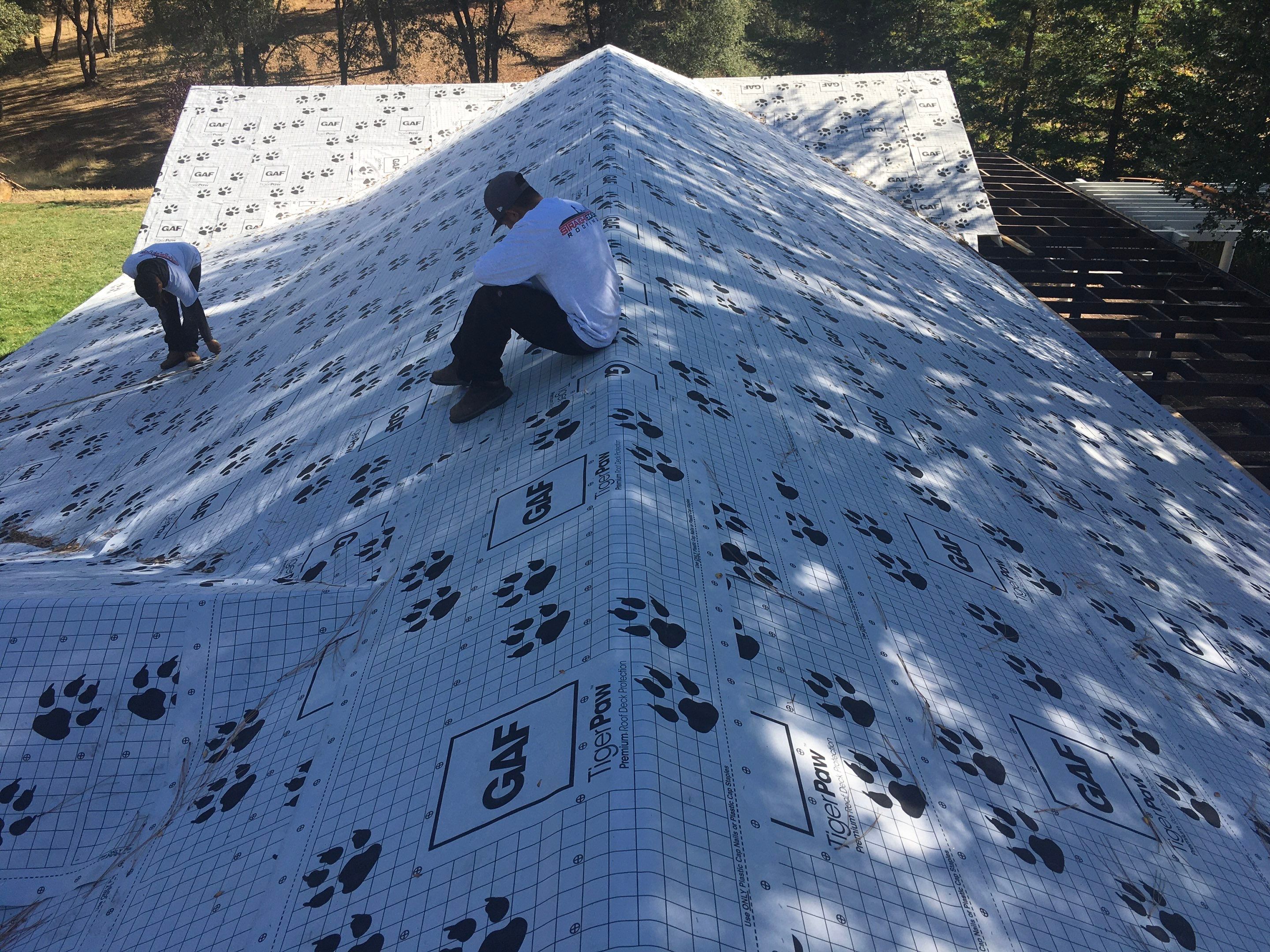Metal roofing installation using Standing seam metal roofing system by Straight Edge Roofing Inc