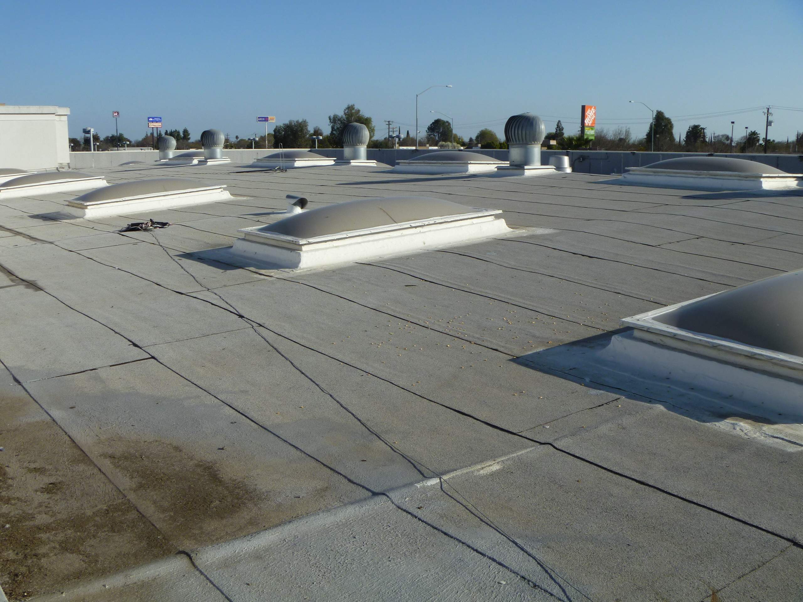Commercial Roofing Installation using Spray foam and Conklin Benchmark/PUMA XL 18 yr warranty coatings by Straight Edge Roofing Inc