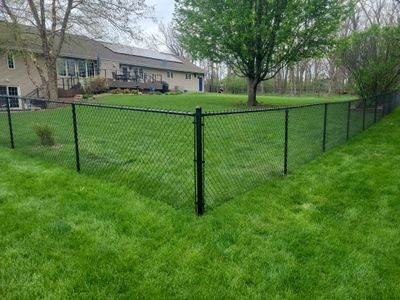 Residential Black Vinyl-Coated Chain Link Perimeter Fence in Garwin