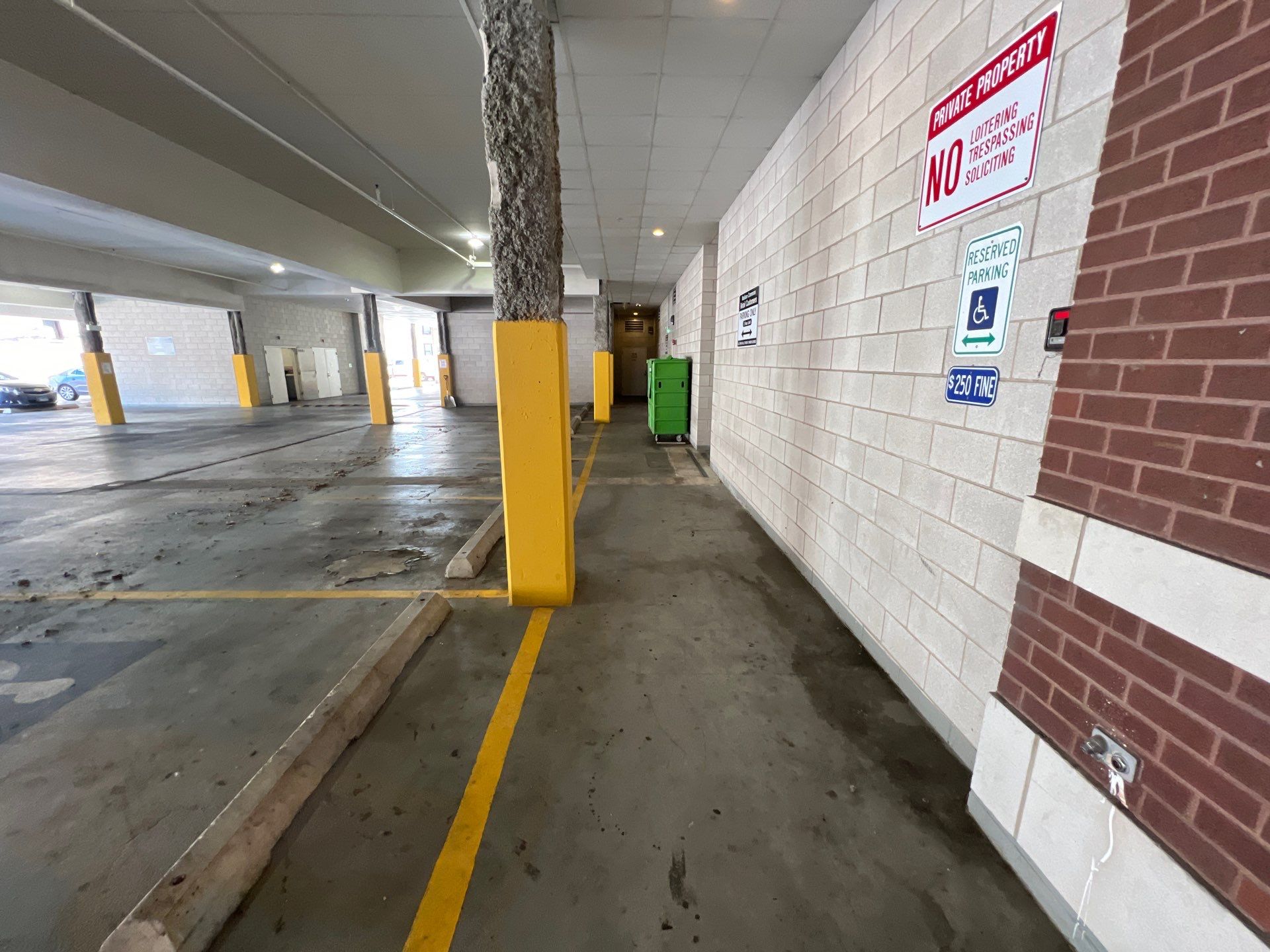 Parking garage using Hot water by Northern Power Washing LLC.