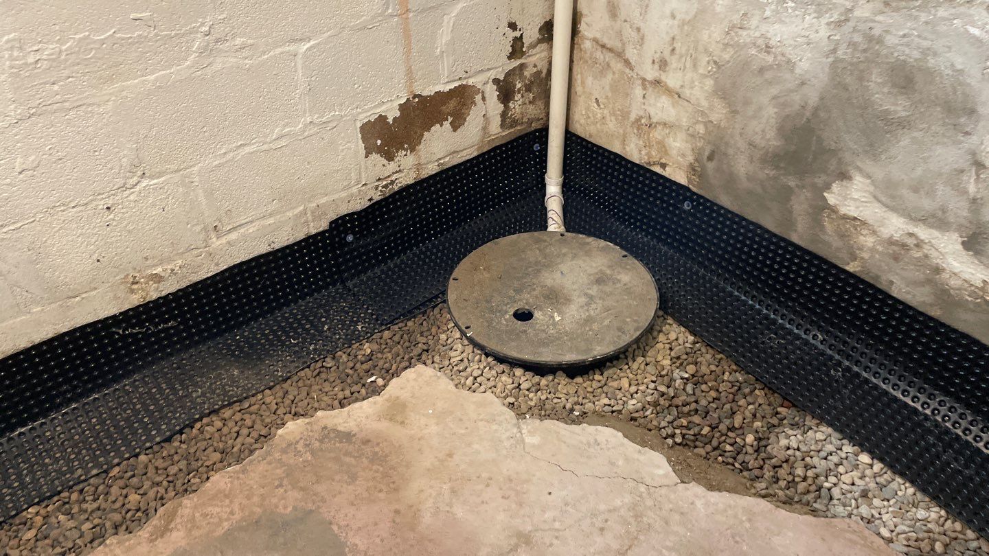 Drain Tile, Window Wells & Buried Discharge in Minneapolis by Waterproofing Northeast