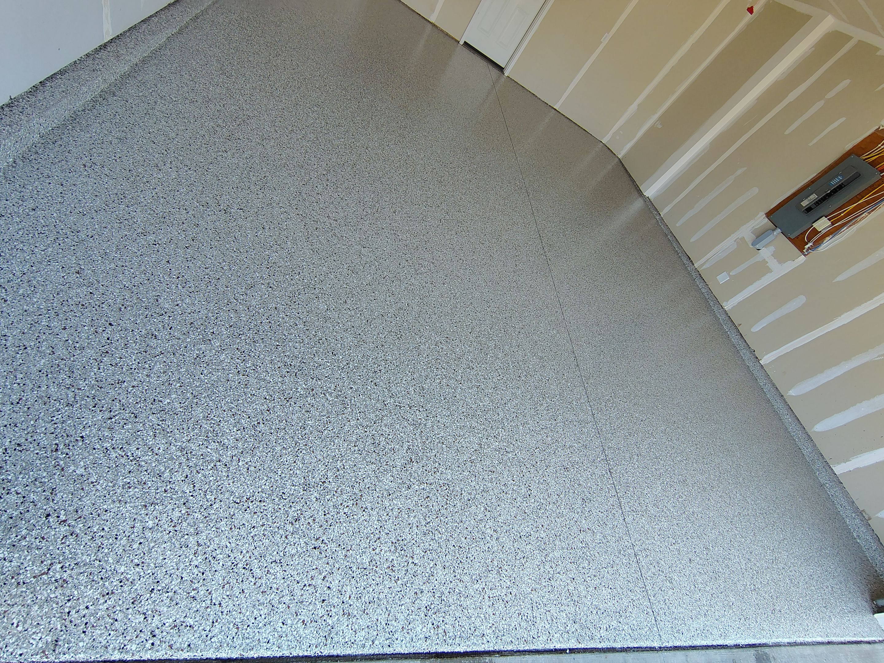 Custom Epoxy Garage Floor and Patio Coating in Sioux Falls by Select Painting, Coatings & Garage Cabinets