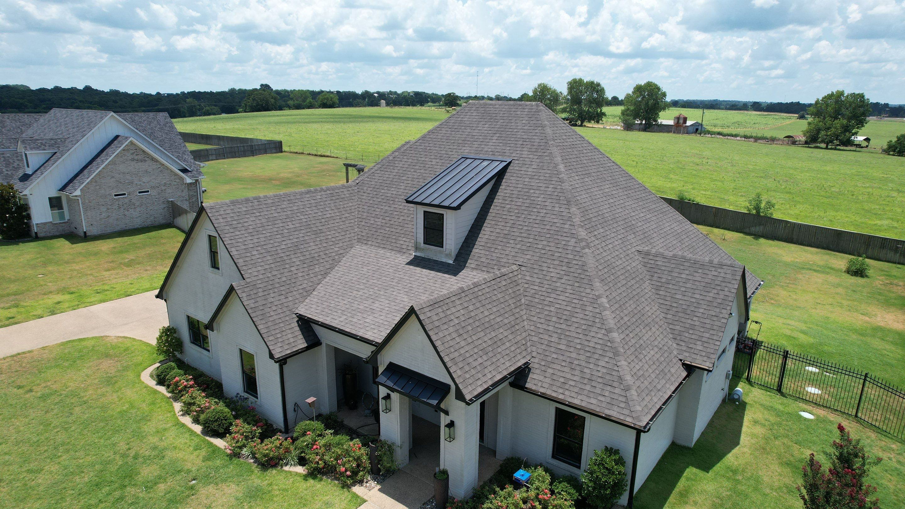 Architectural Shingle and Standing Seam Metal Roof Installation in Mount Selman by Sky High Roofing