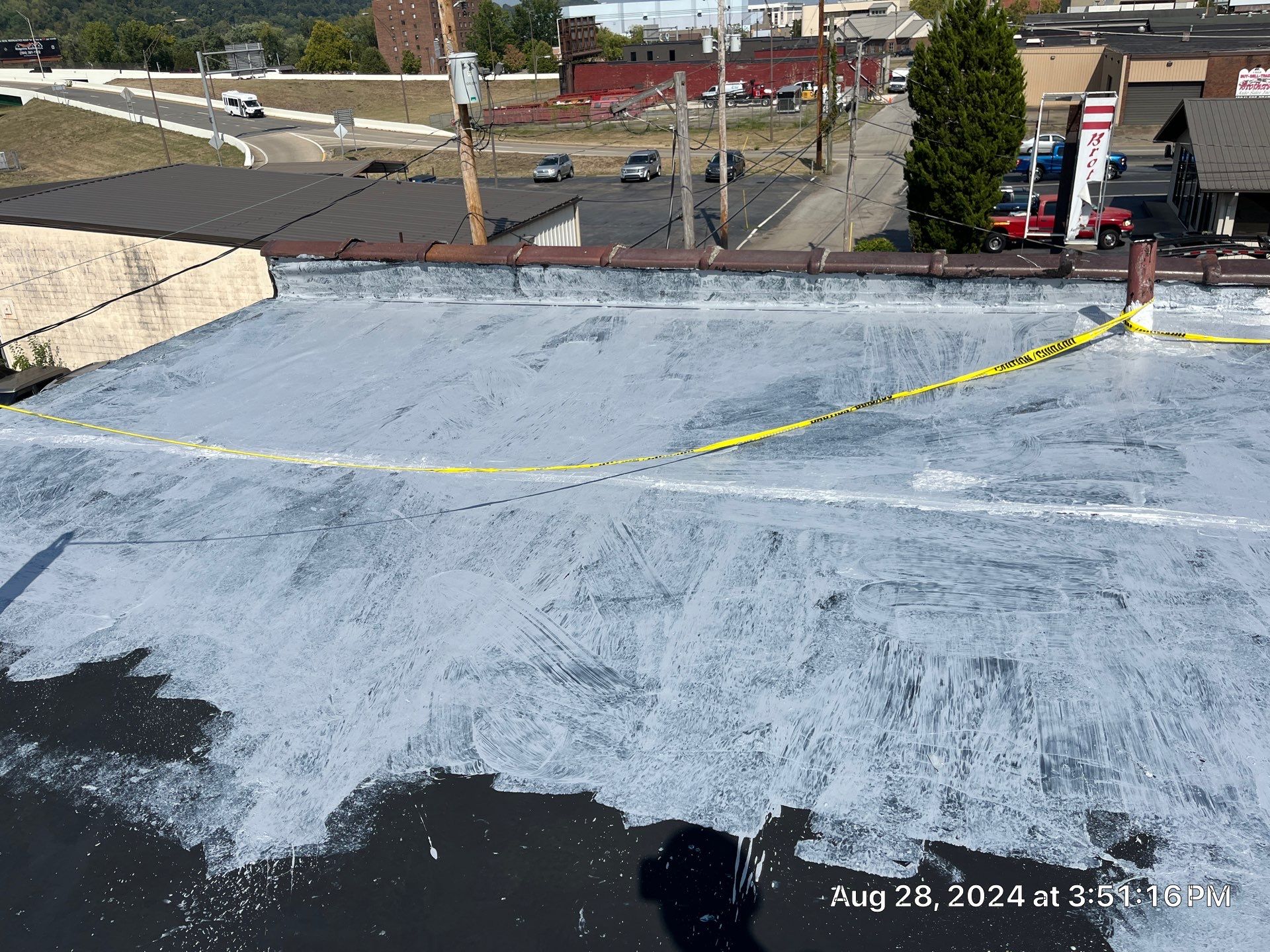 Commercial Roofing Installation using smartcoat Roof coating by Fahey Roofing + Contracting