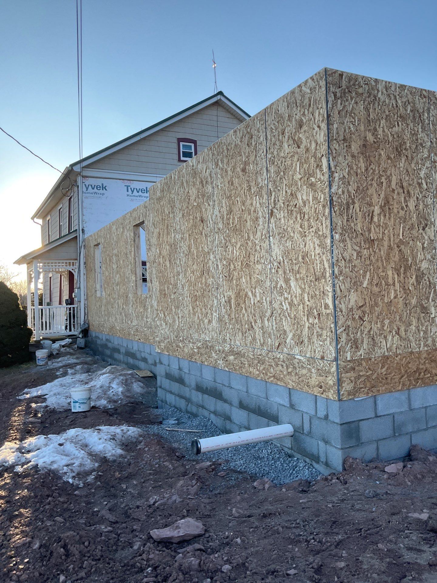 Multi-Story Residential Addition Featuring Textured Metal Siding in Millersburg by Esh Builders