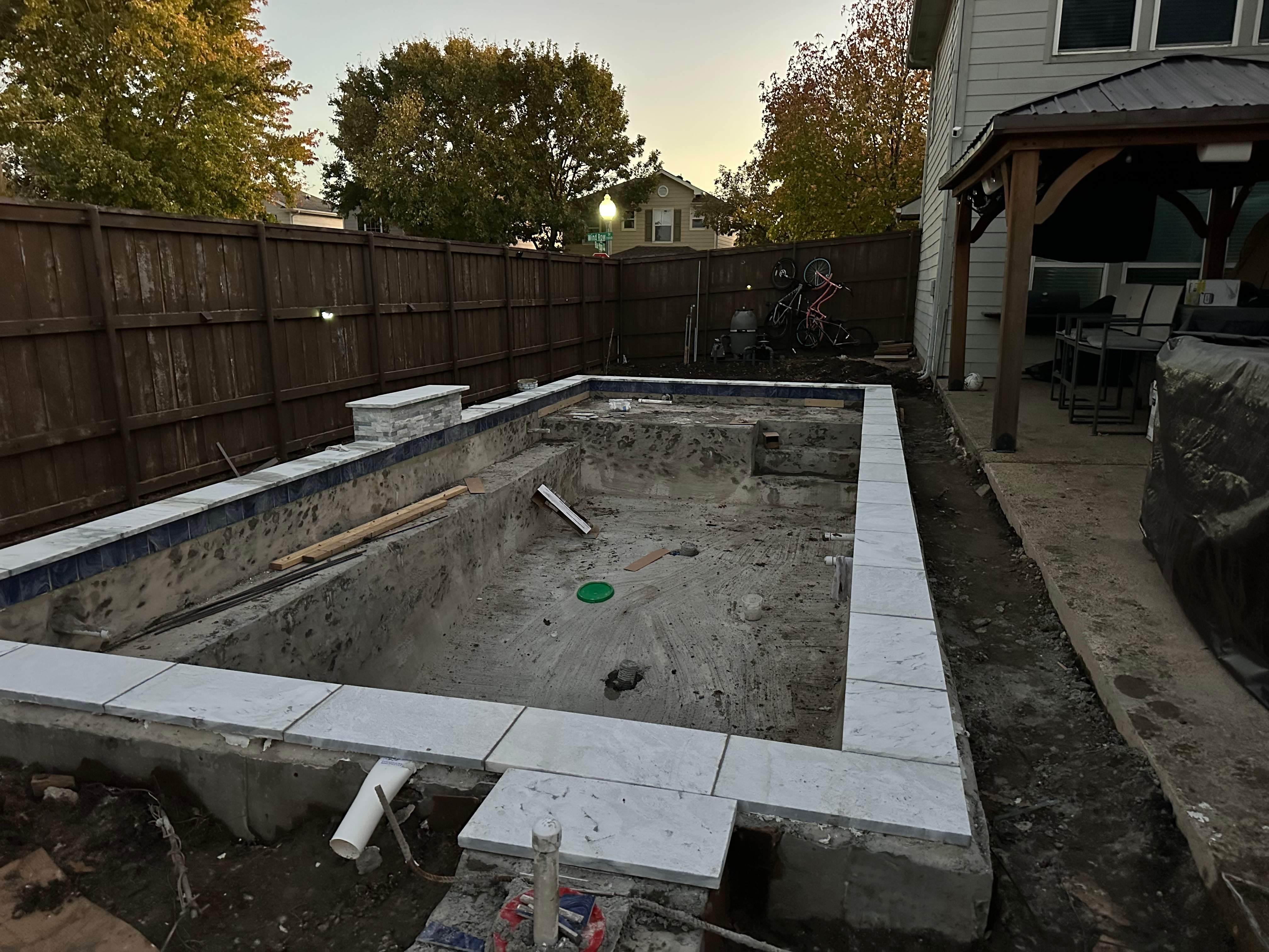 Pool with Turf and Raised Wall by Pinnacle Pools and Spas - DFW