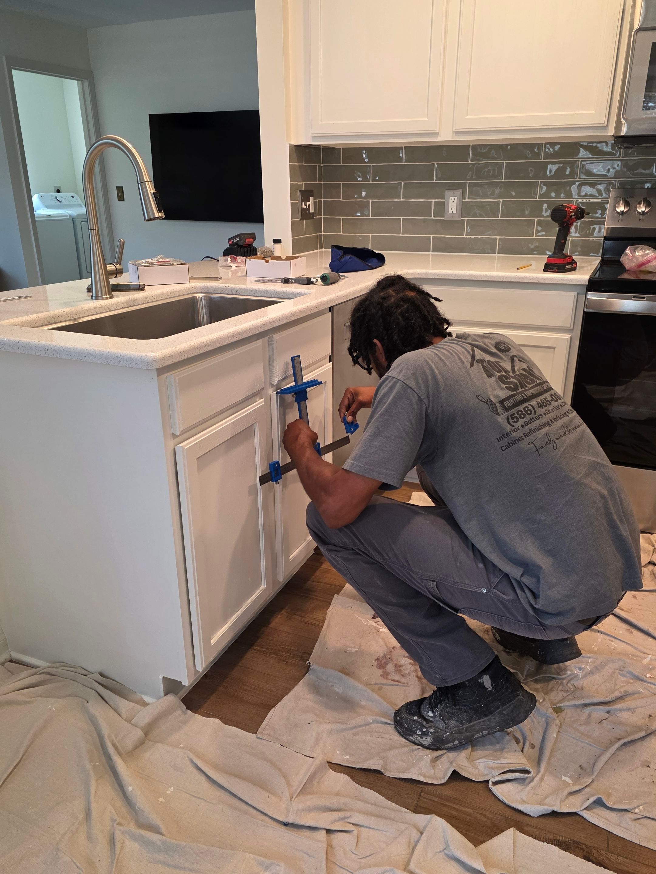 White Shaker Cabinet Installation and Quartz Countertop Replacement in Rochester by Top Shelf Painter