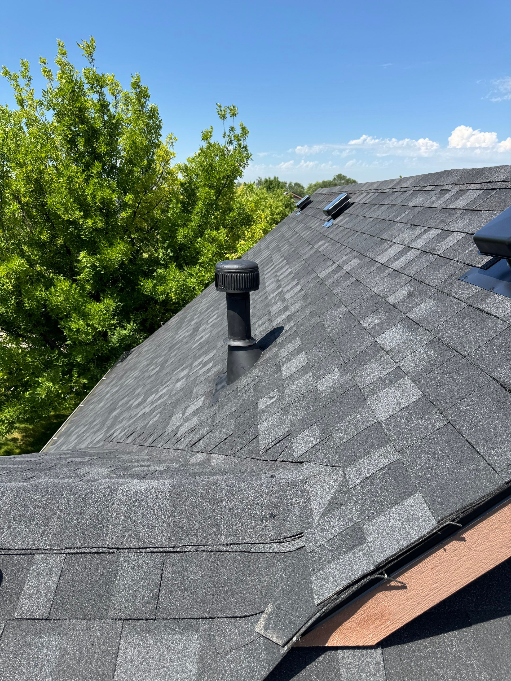 Residential Roof Replacement Featuring Charcoal Grey Architectural Shingles by Olive Roofing