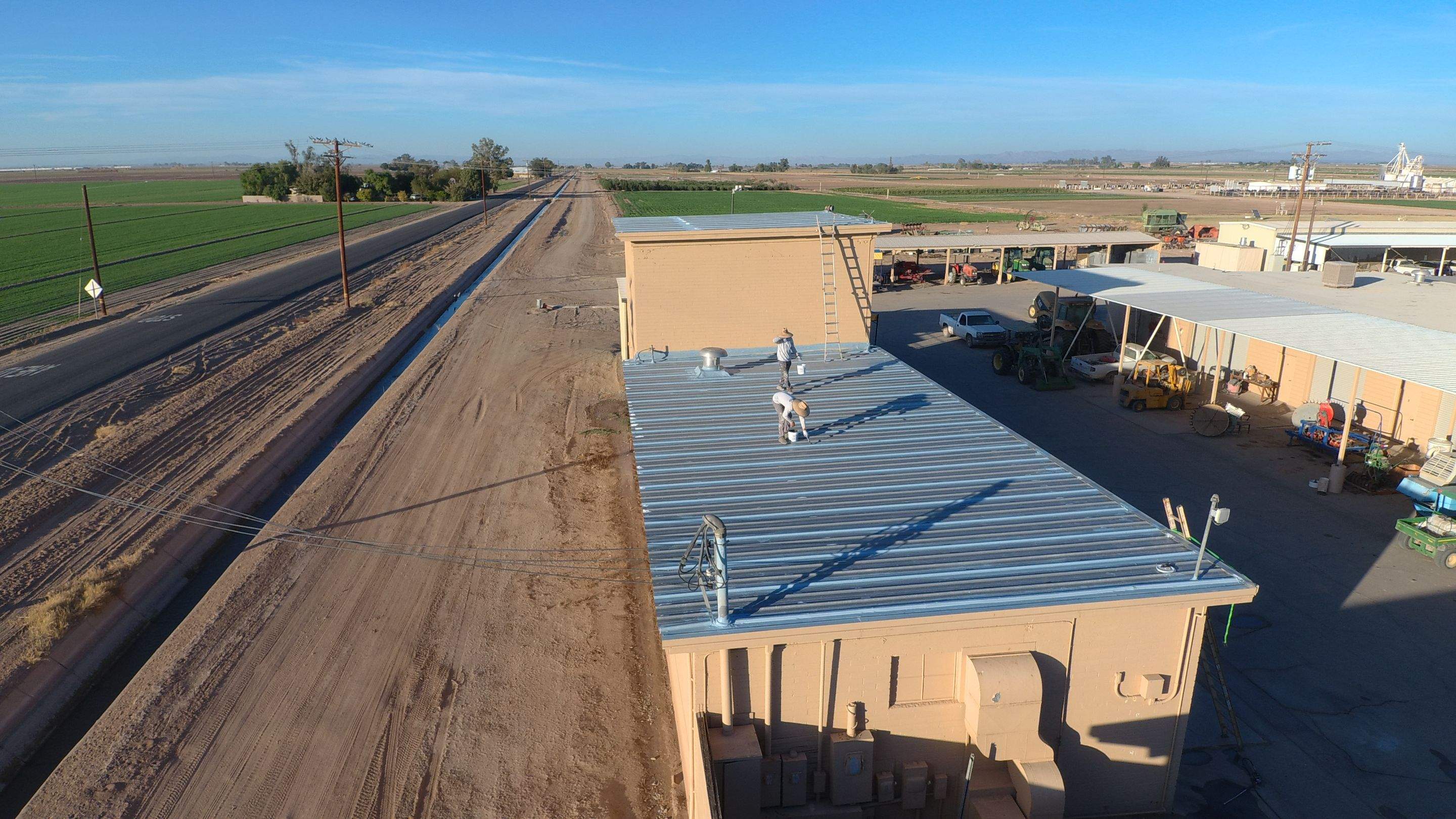 Metal roof restoration on commercial roof using Conklin Benchmark/PUMA XL fabric and coating by Straight Edge Roofing Inc