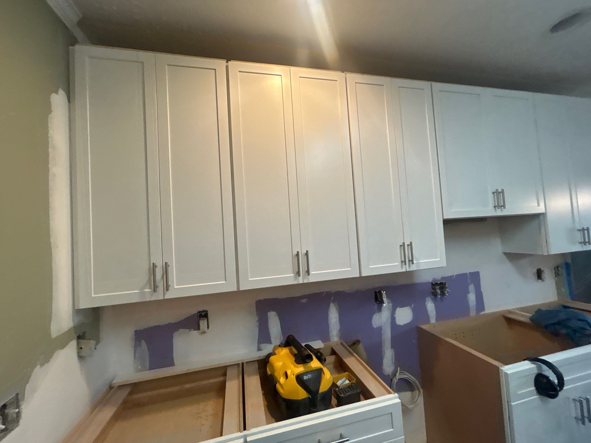 Complete Kitchen Renovation Featuring White Shaker Cabinetry in Fayetteville by Karcher Roofing & Construction