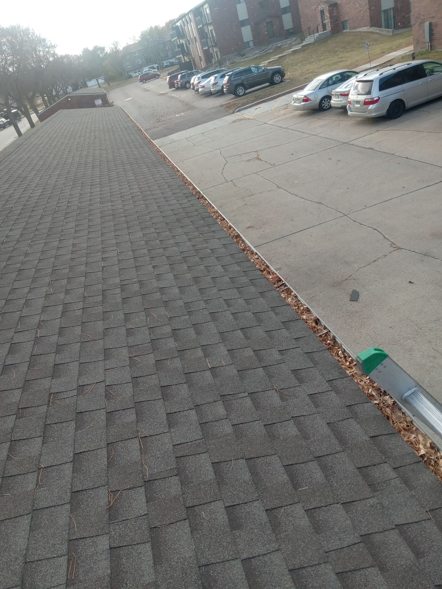 Commercial gutter cleaning Bismarck, ND before photo with filled gutters