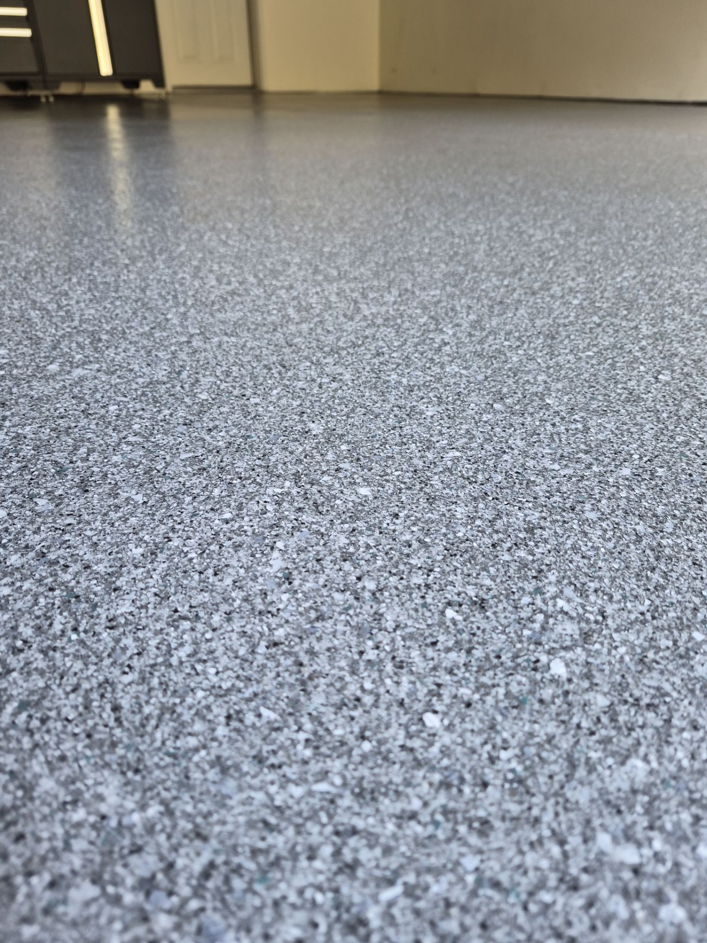 Liberty Lake Garage Transformation with Turquoise Hybrid Polyurea Floor by Croc Coatings, LLC