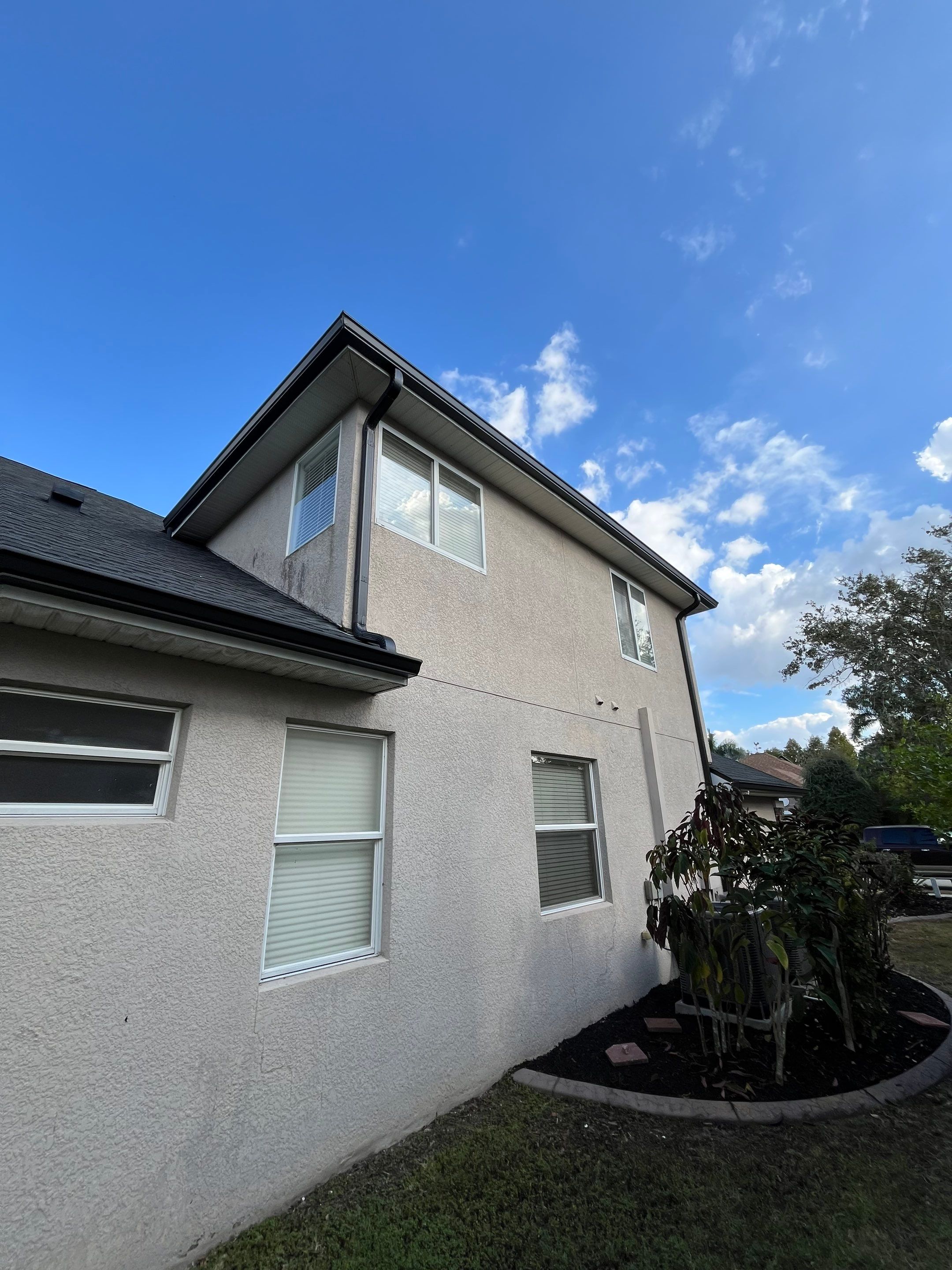 Black 6-inch Seamless Gutters for Modern Ellenton Homes FL by Gutter Professors