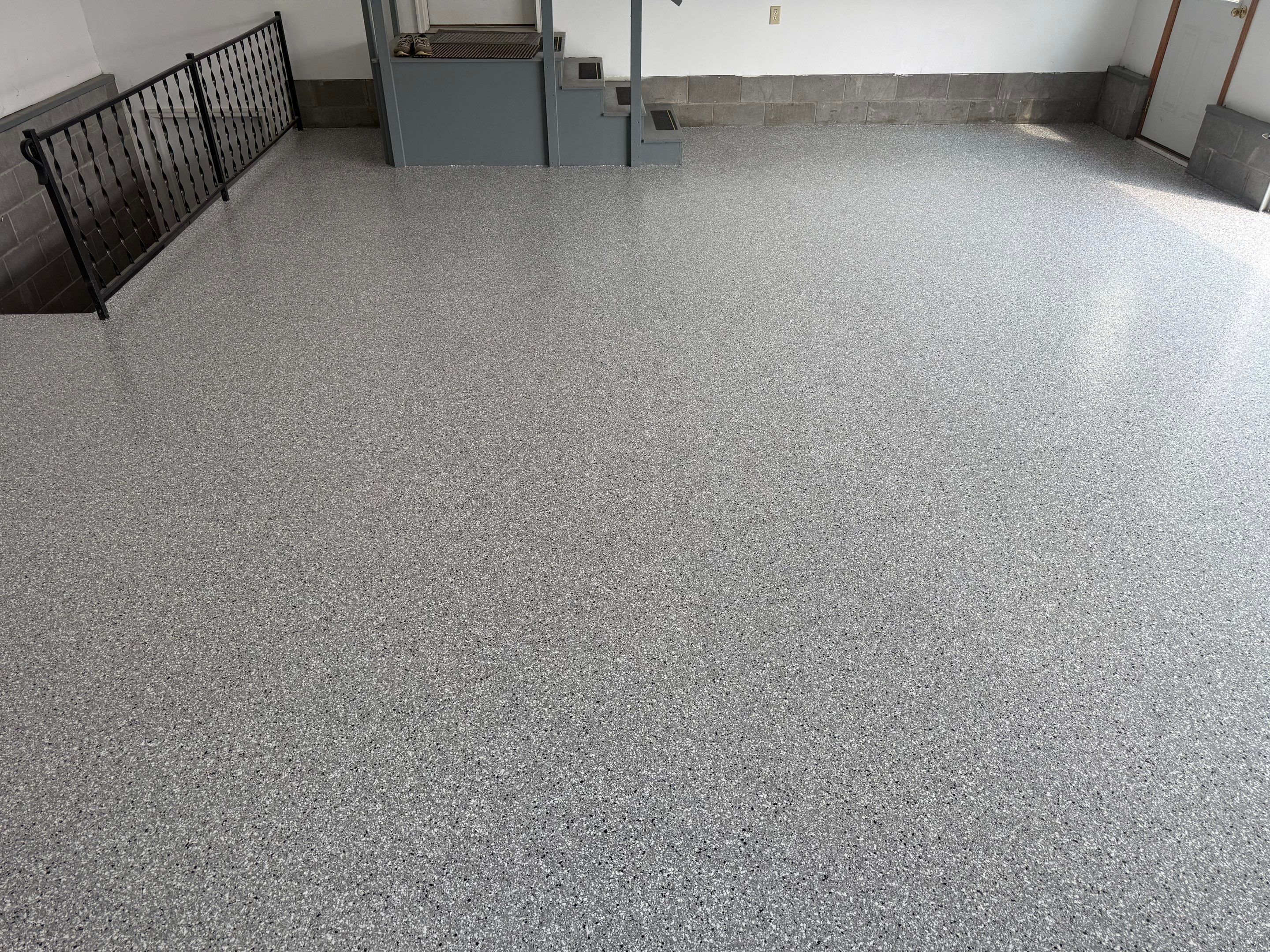Feather Grey Garage Floor Coating and Concrete Restoration in Mitchell by Select Painting, Coatings & Garage Cabinets