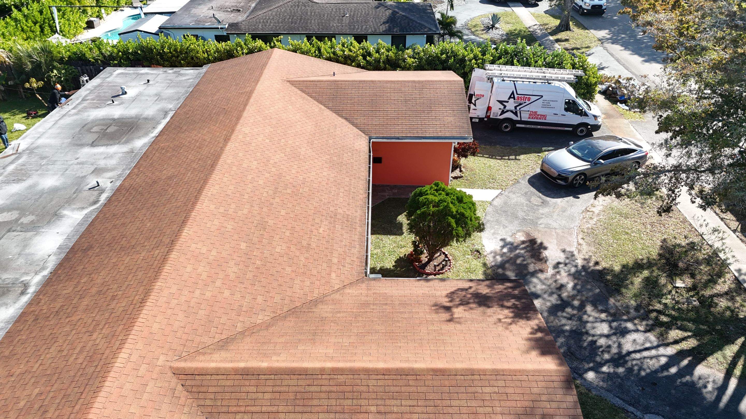Insulated Screen Enclosure and Wood Tile Deck Installation in Plantation by Aastro Roofing
