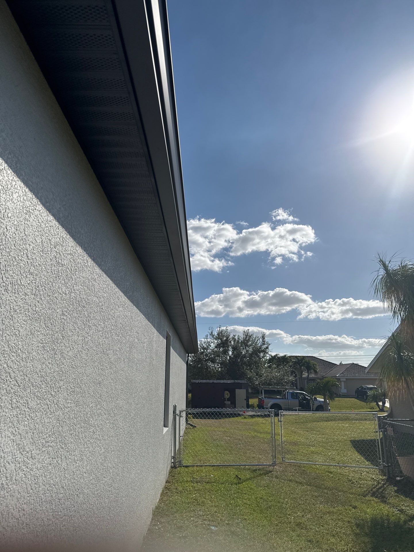 Dark Seamless Gutters and Downspouts in Cape Coral FL by Gutter Professors