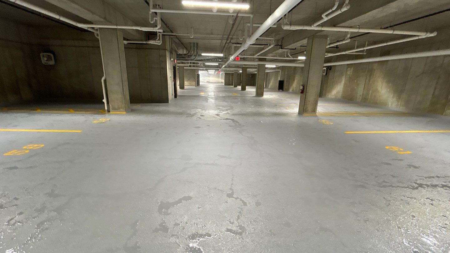 Parking garage using Hot water by Northern Power Washing LLC.