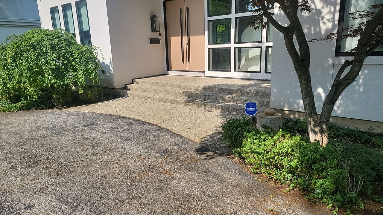 Aggregate concrete cleaning and sealing using Surebond SB-9000 by Northern Power Washing LLC.