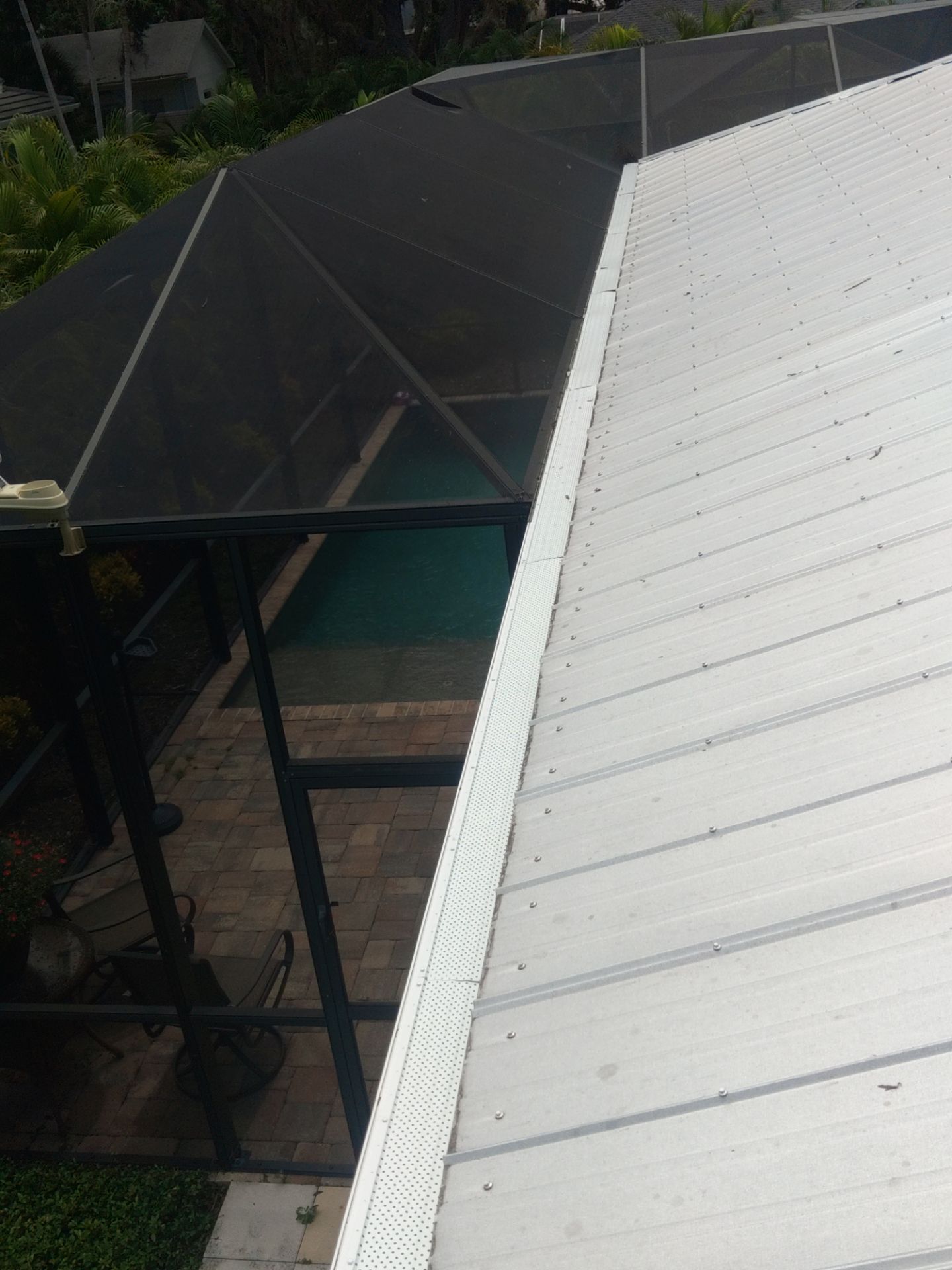 Gutter guards installation combined with gutter cleaning in Sarasota, FL by Gutter Professors