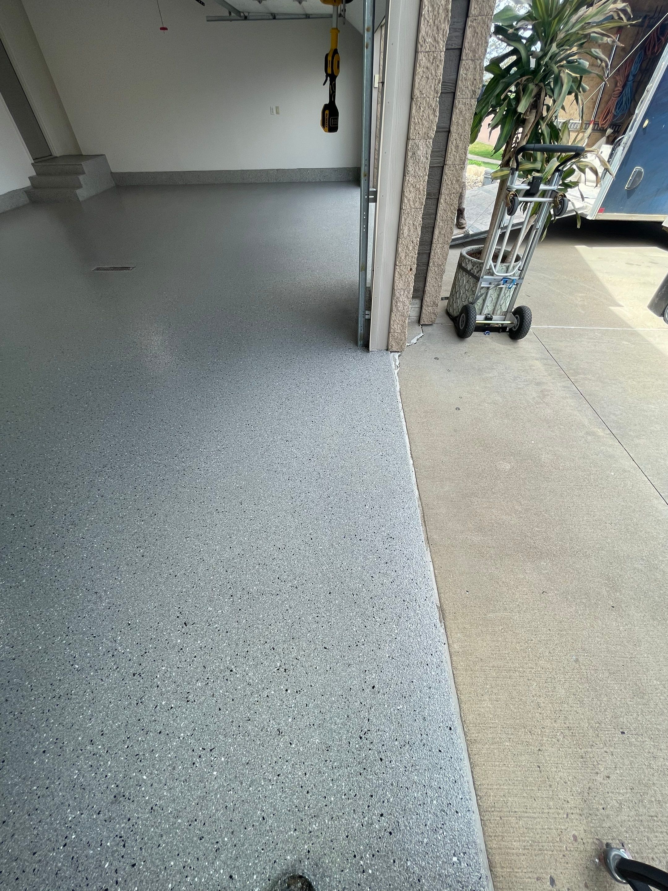 Residential Garage Floor Coating with Grey Speckled Epoxy Finish by Select Painting, Coatings & Garage Cabinets