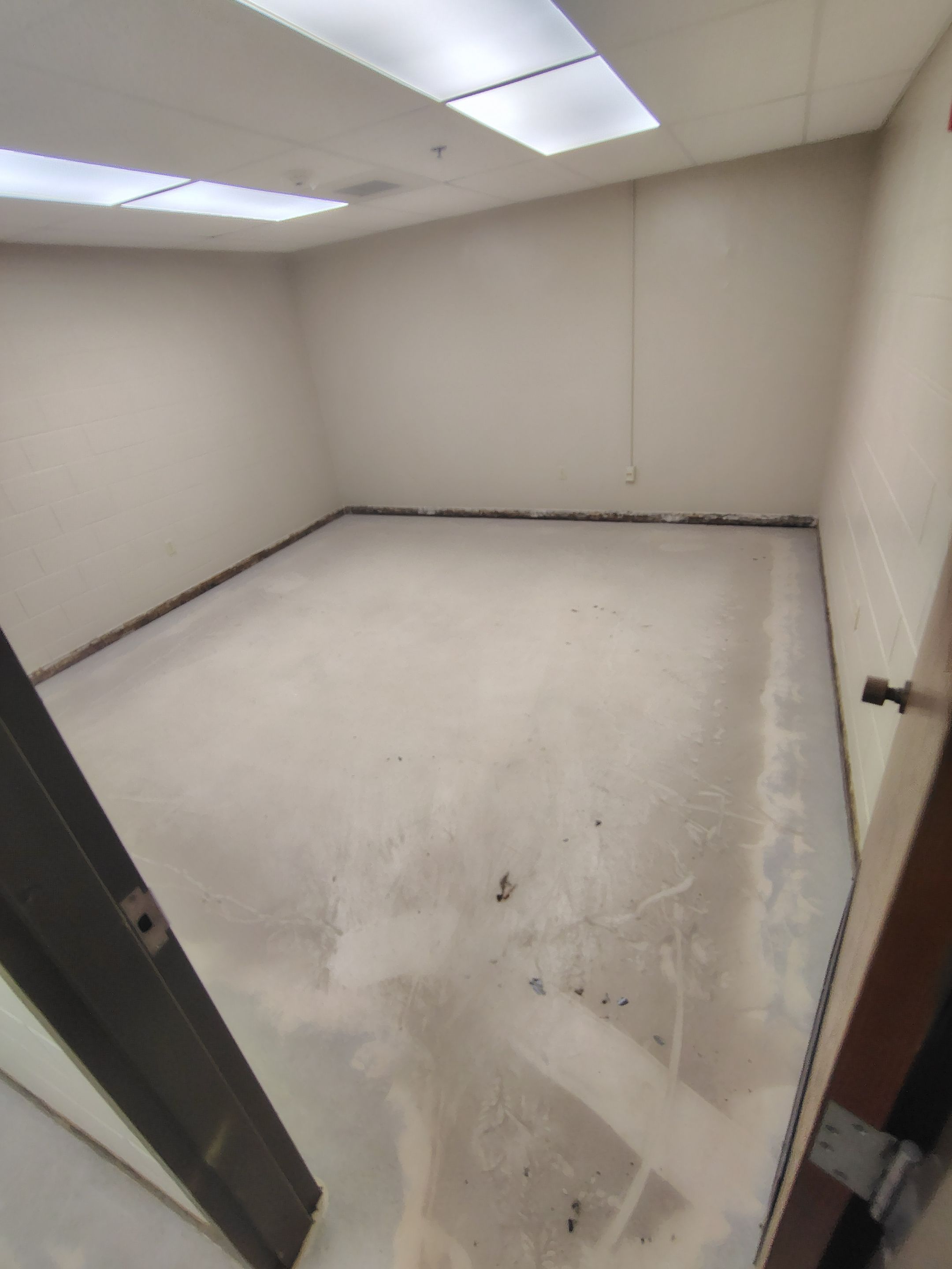 Industrial Flake Epoxy Floor Installation at Pierre National Guard Facility by Select Painting, Coatings & Garage Cabinets