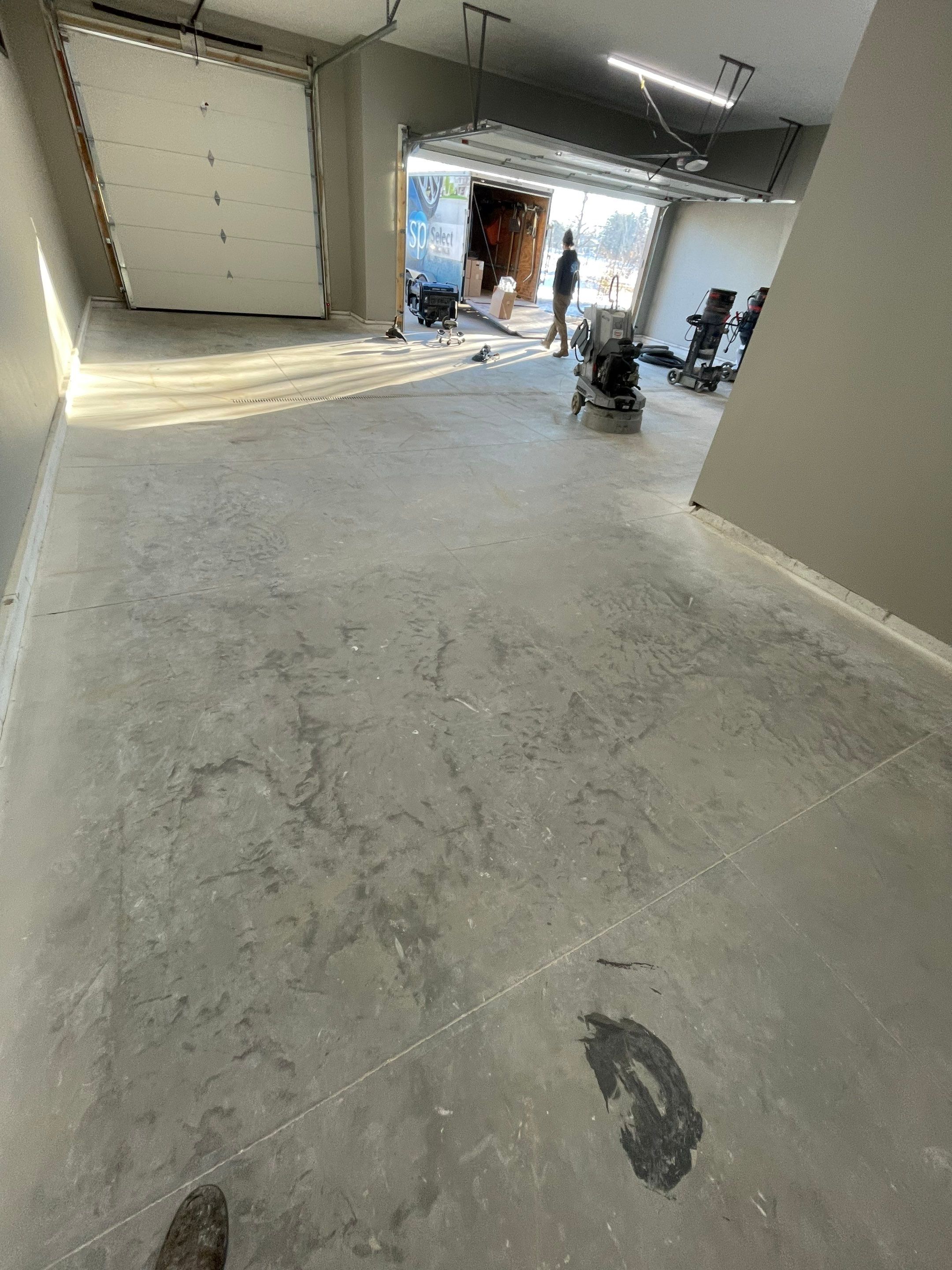 Decorative Flake Concrete Coating Installation in North Sioux City by Select Painting, Coatings & Garage Cabinets