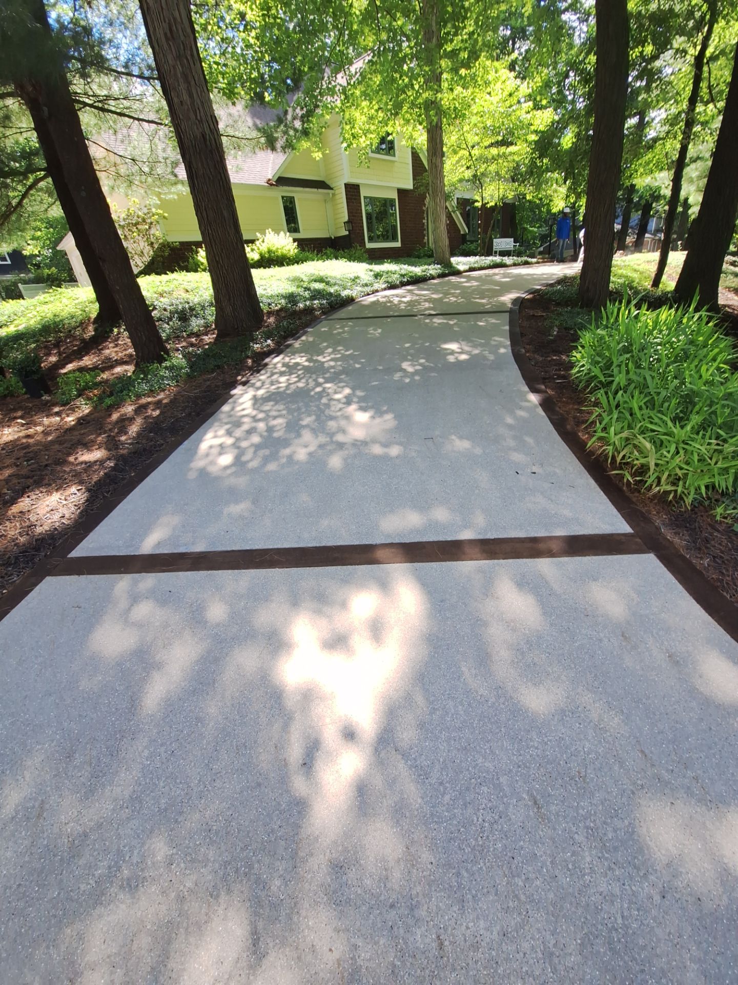Concrete Driveway and Walkway Staining With Espresso Borders in Grand Rapids by Gordon Painting