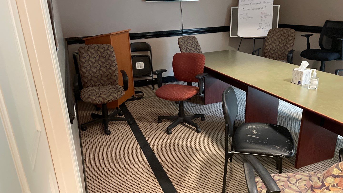 Office Remodel from Worn Out Carpet to Sleek Glued Down LVP by Footprints Floors of Coastal Carolina