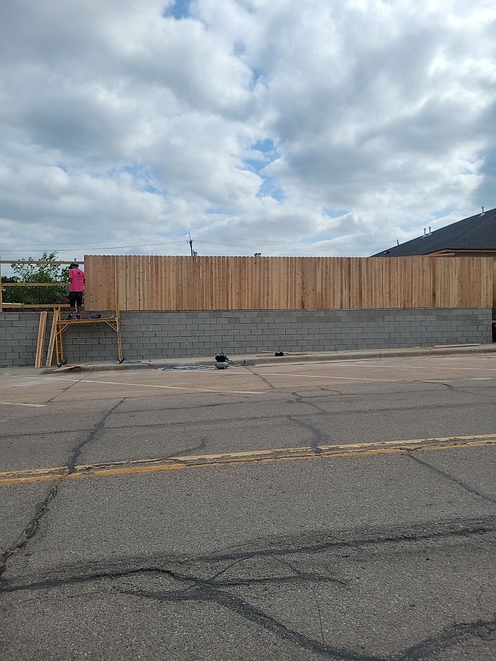 Cedar Fence using Cedar Pickets and Metal Poles by Clays Services Inc