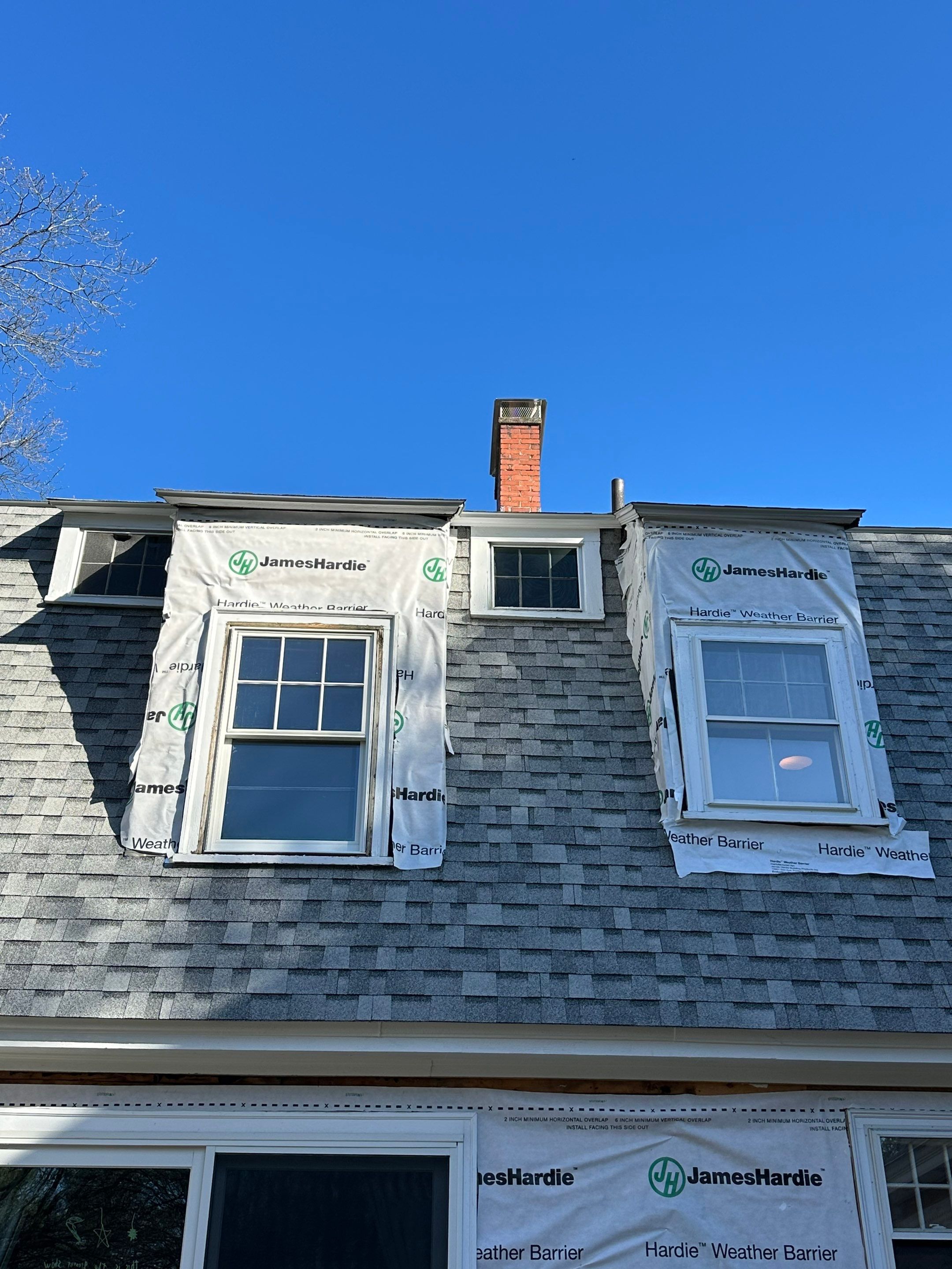 White cedar shingles and windows in Wayland, MA by UBrothers Construction