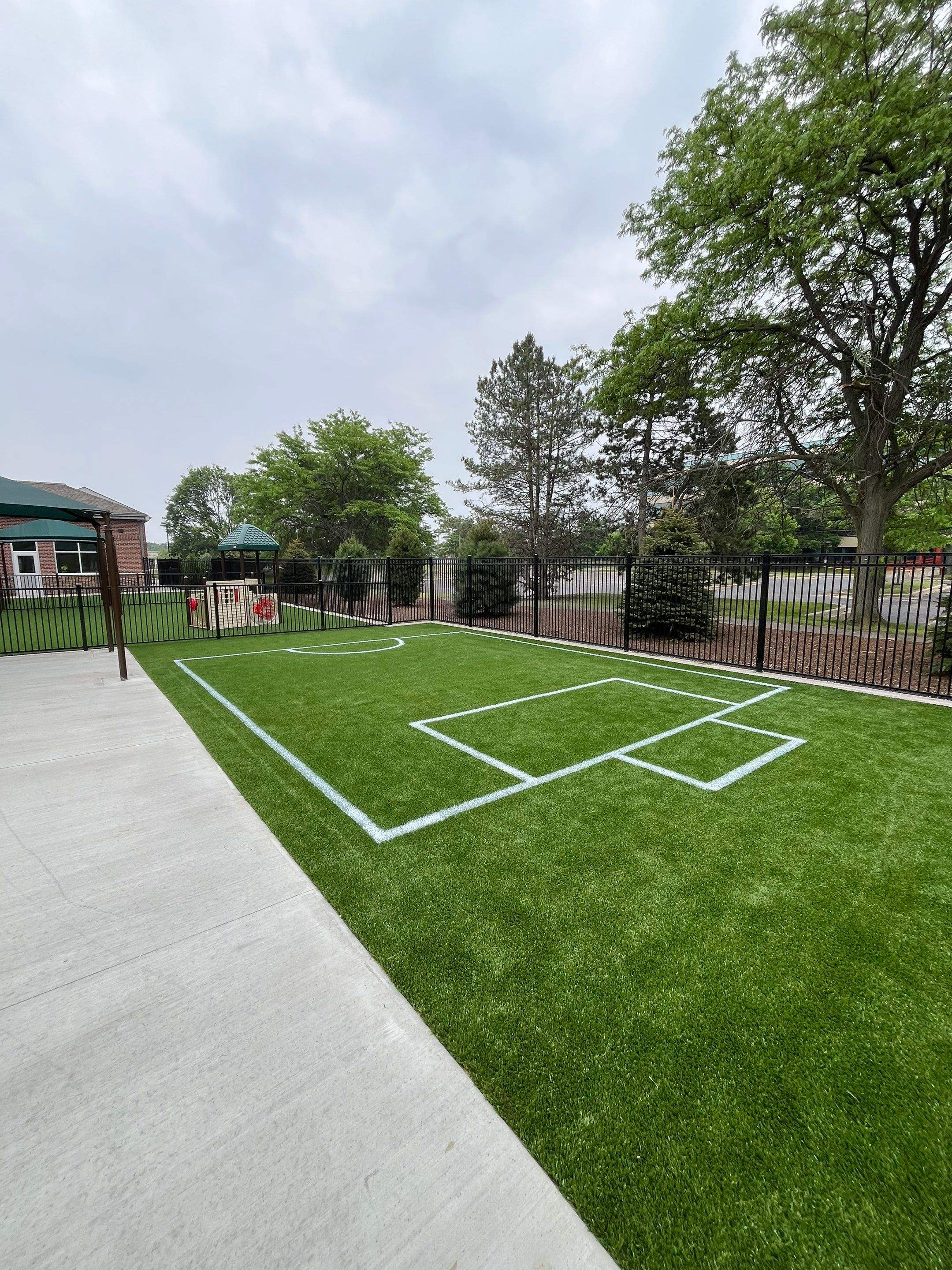 KinderCare of Lincolnshire Commercial Playground Turf Installation by Southwest Greens Midwest