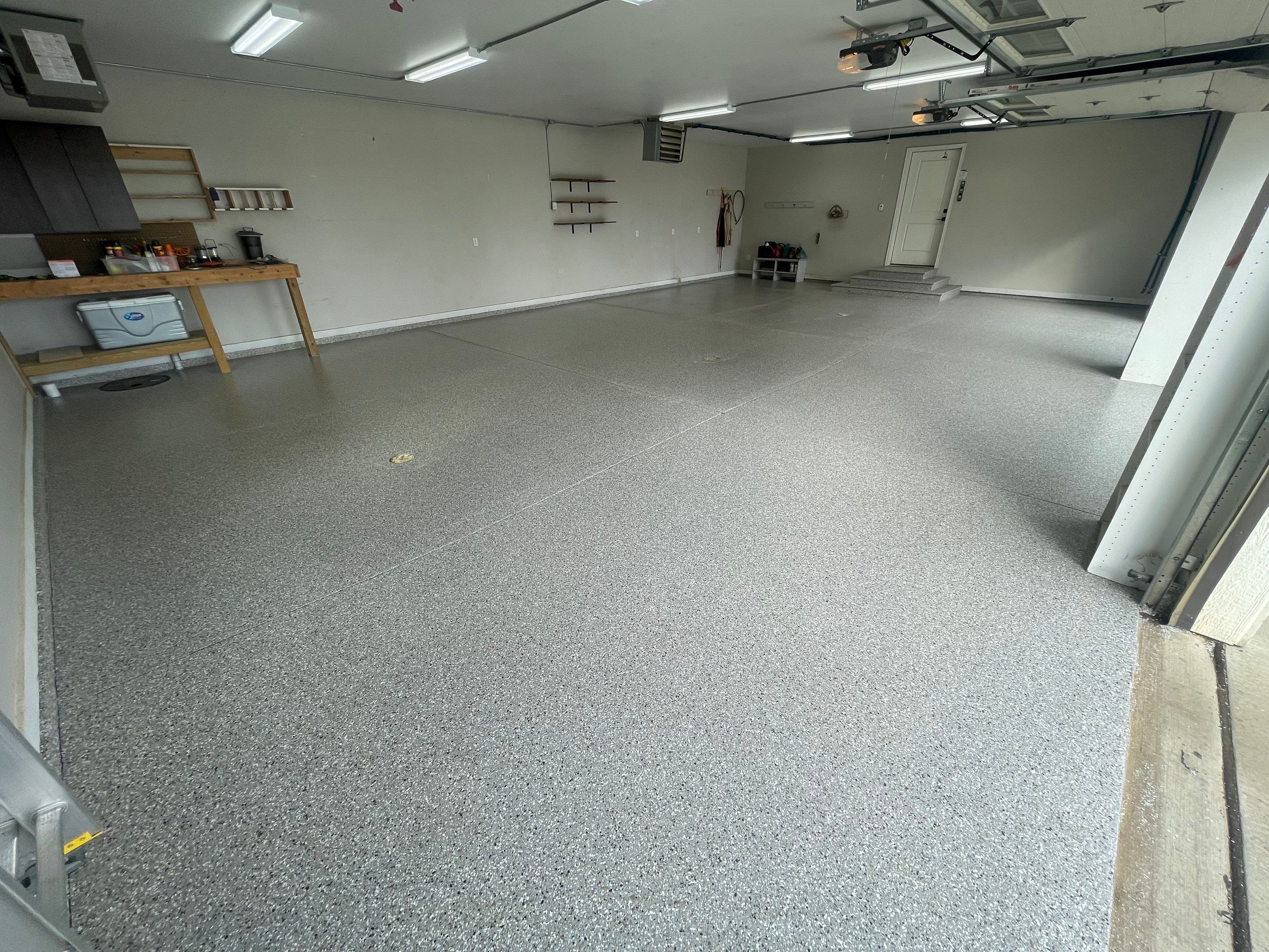 Grey Speckled Polyuera Garage Floor Coating for Hartford Three-Car Garage by Select Painting, Coatings & Garage Cabinets