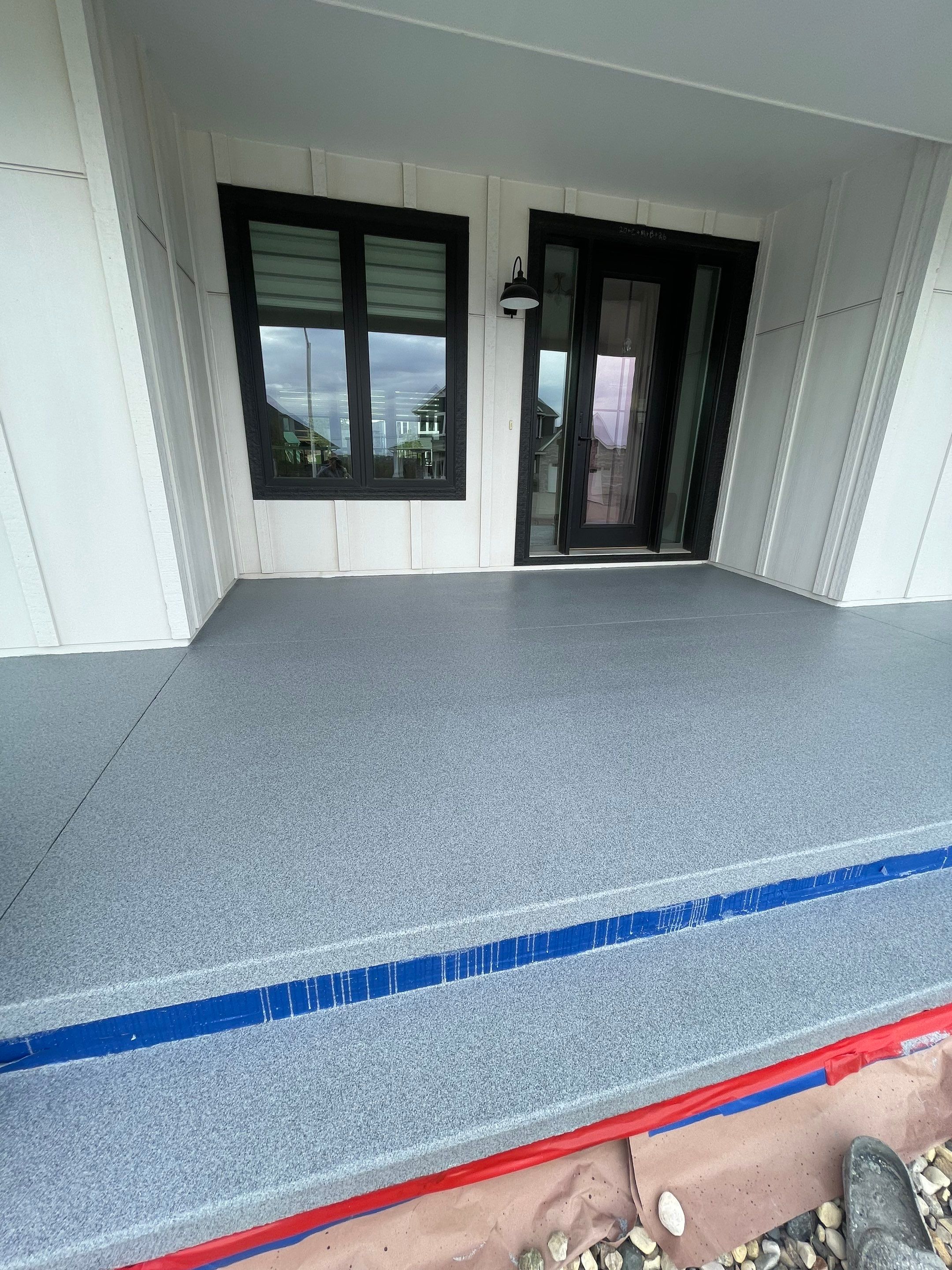 Grey Speckled Concrete Porch Coating for Sioux Falls Home by Select Painting, Coatings & Garage Cabinets