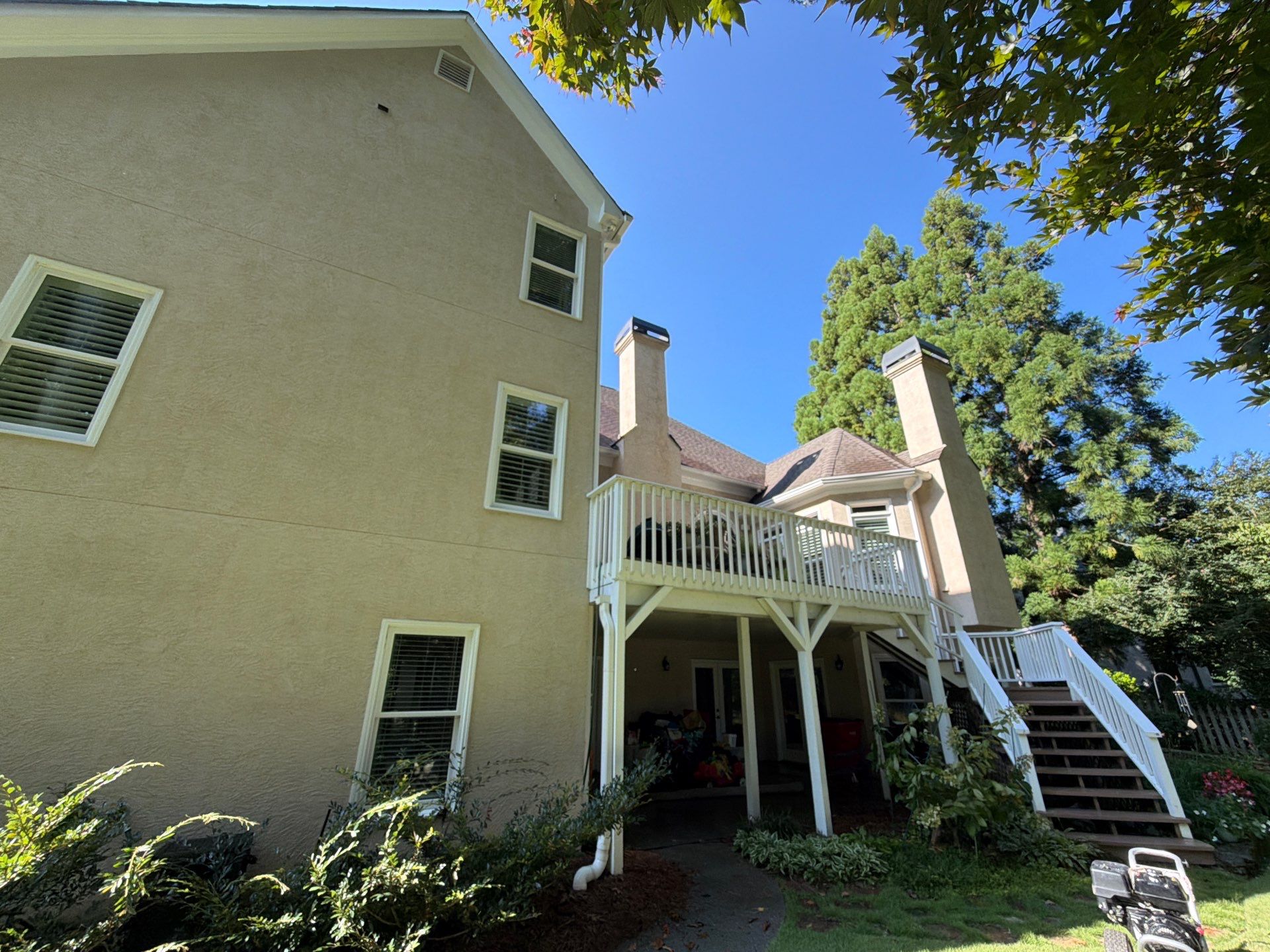 Multi-Story Stucco Home Exterior Painting and Garage Refresh in Marietta by Swift Home Renovations 