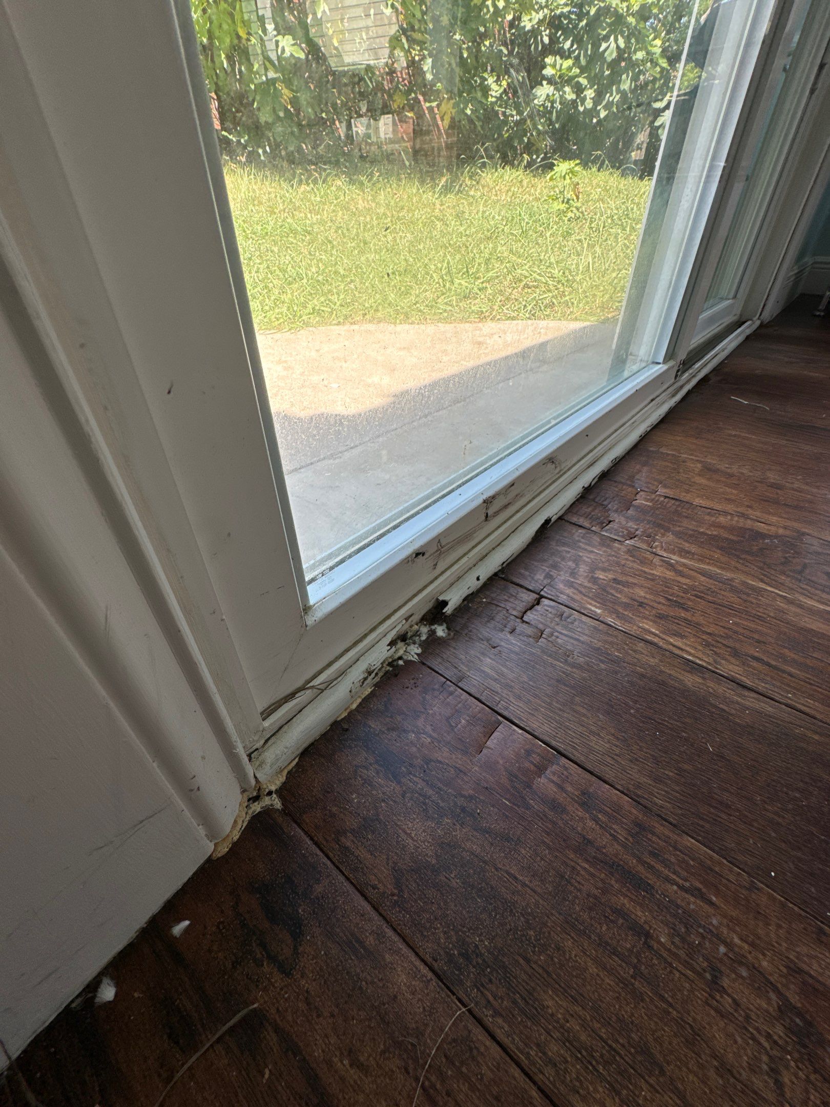 Seamless Floor Upgrade & Critical Water Damage Repair: Complete Patio Door Fix by Tibi Soli LLC